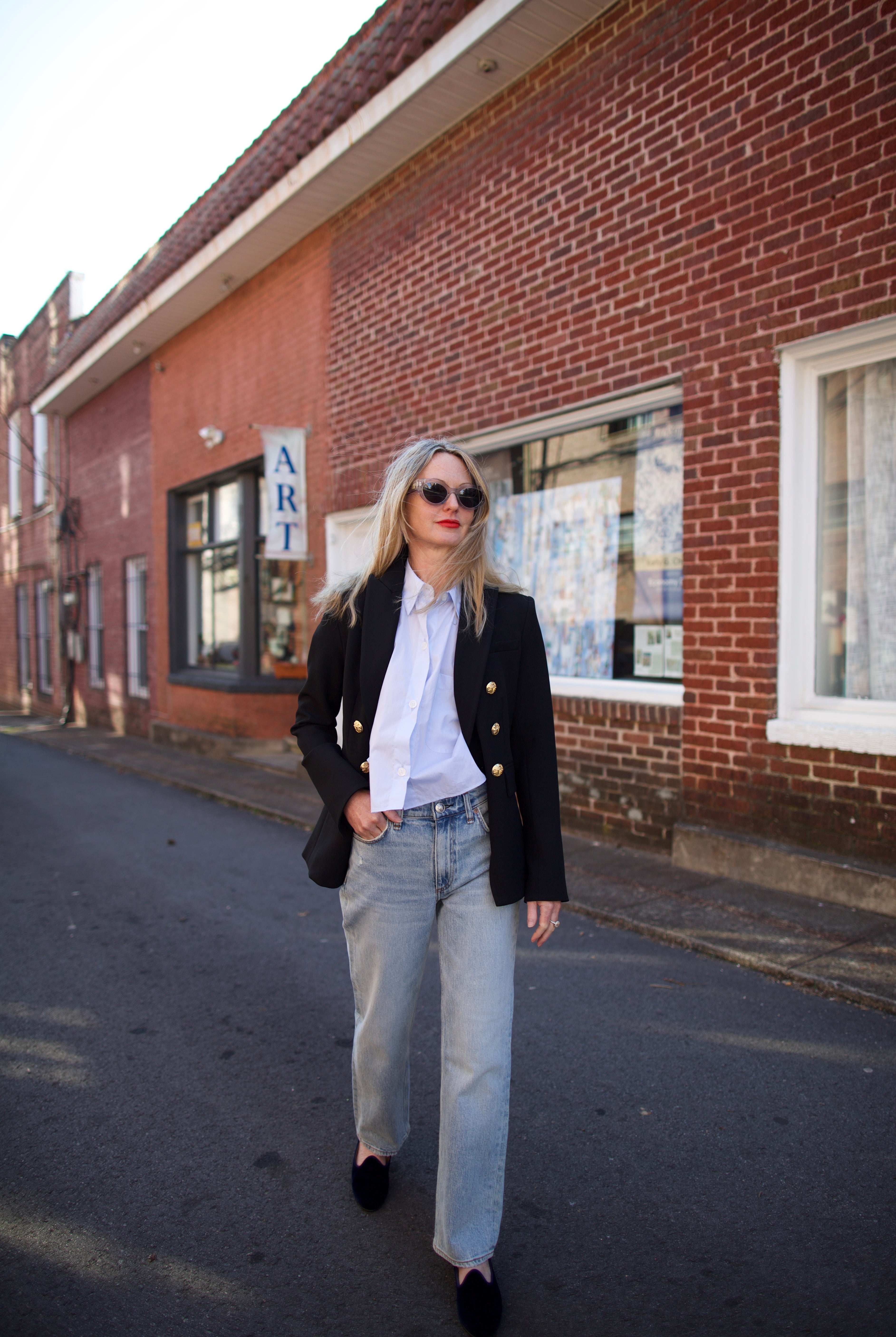 Mature woman wearing Rag and Bone Harlow denim with straight leg, mid-rise stretch denim, ankle length jean light wash