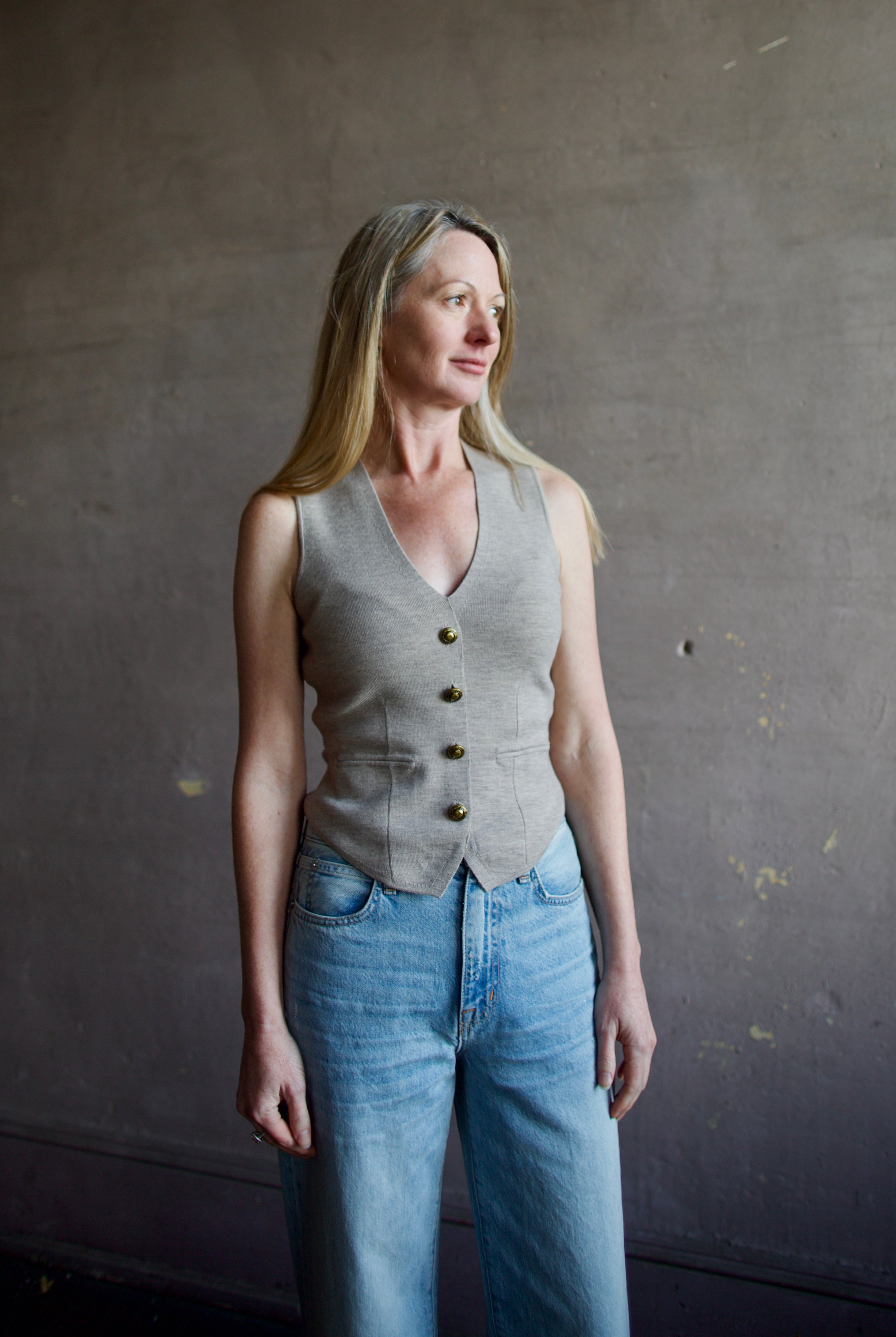 Mature woman wearing advanced contemporary Women's Rag and Bone Ella Vest in dark taupe offers a sophisticated layering in fitted knit