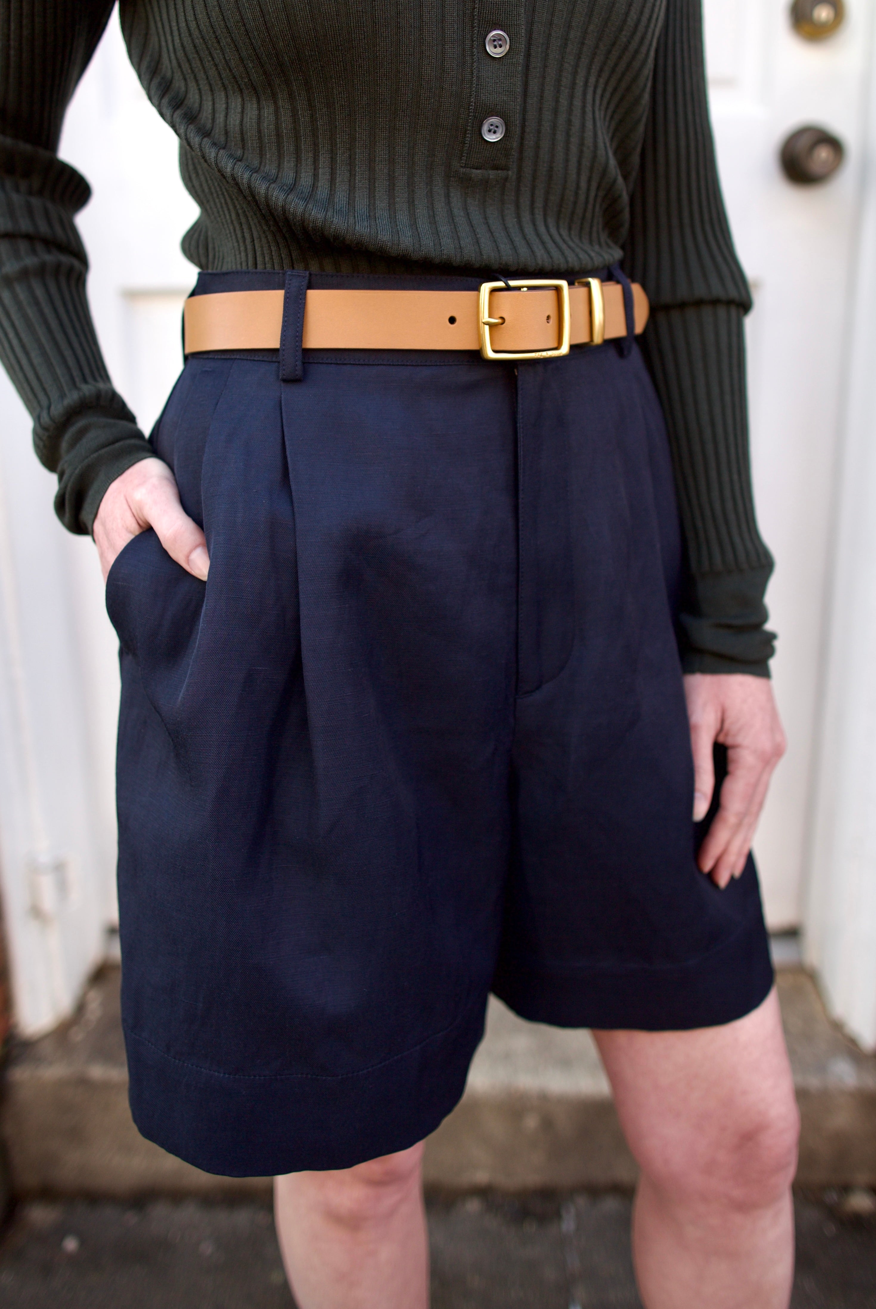 mature woman wearing luxury Rag and Bone tan brown leather belt square matte brass color buckle 1" wide
