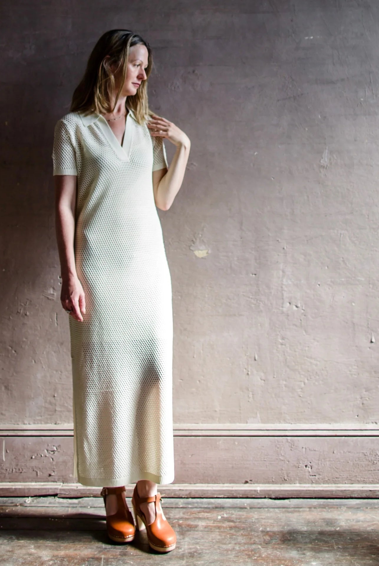 Image featuring a woman wearing the Rag & Bone Leah Knit Sheath Maxi Dress in ecru.
