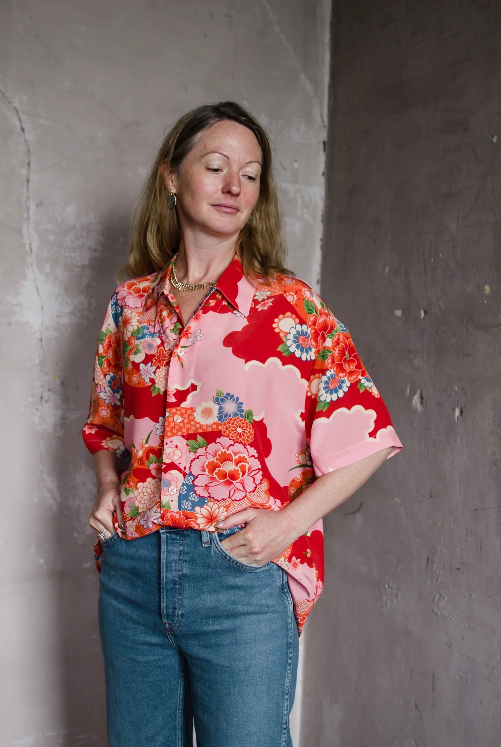 Image featuring a woman wearing Re/Done Aloha shirt with a relaxed fit in a lightweight fabric, spread collar, short sleeves and a button-front closure.