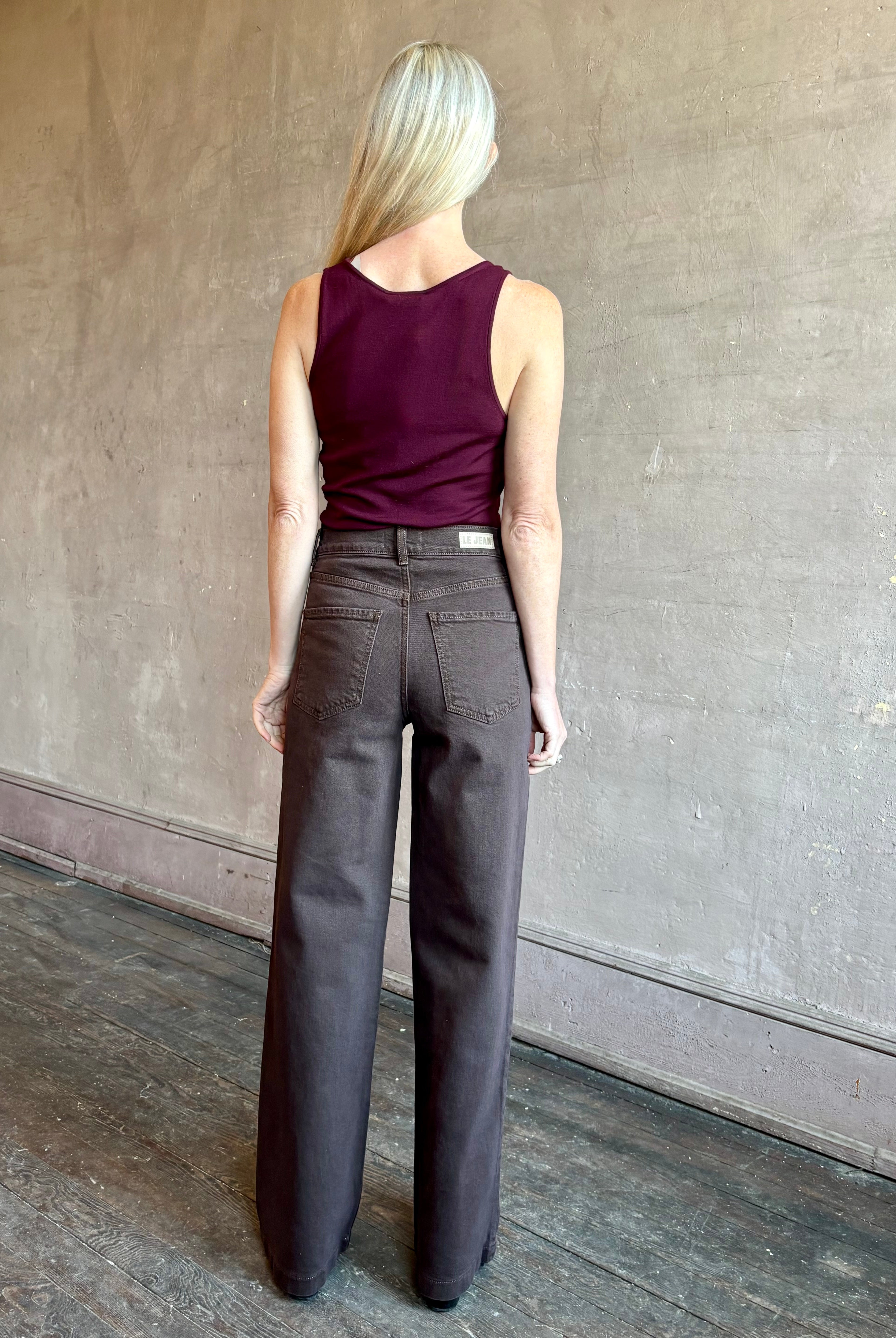 Image of mature woman wearing premium wool SABLYN Addyson V-Neck Layering Tank Top in a rich Bordeaux