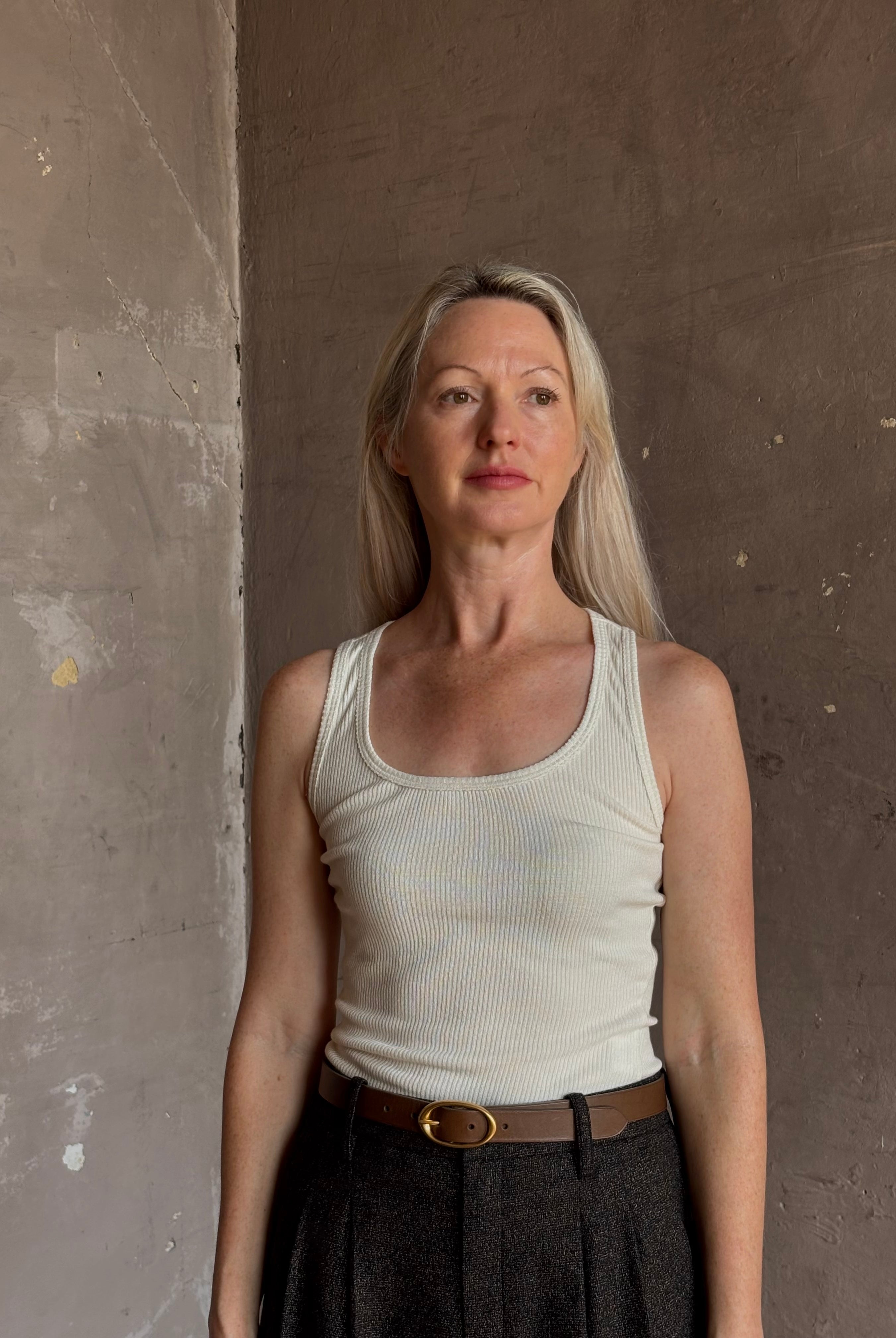 Mature woman wearing Sablyn Coco Scoop Neck cream Tank Top ribbed soft knit comfortable layering basic