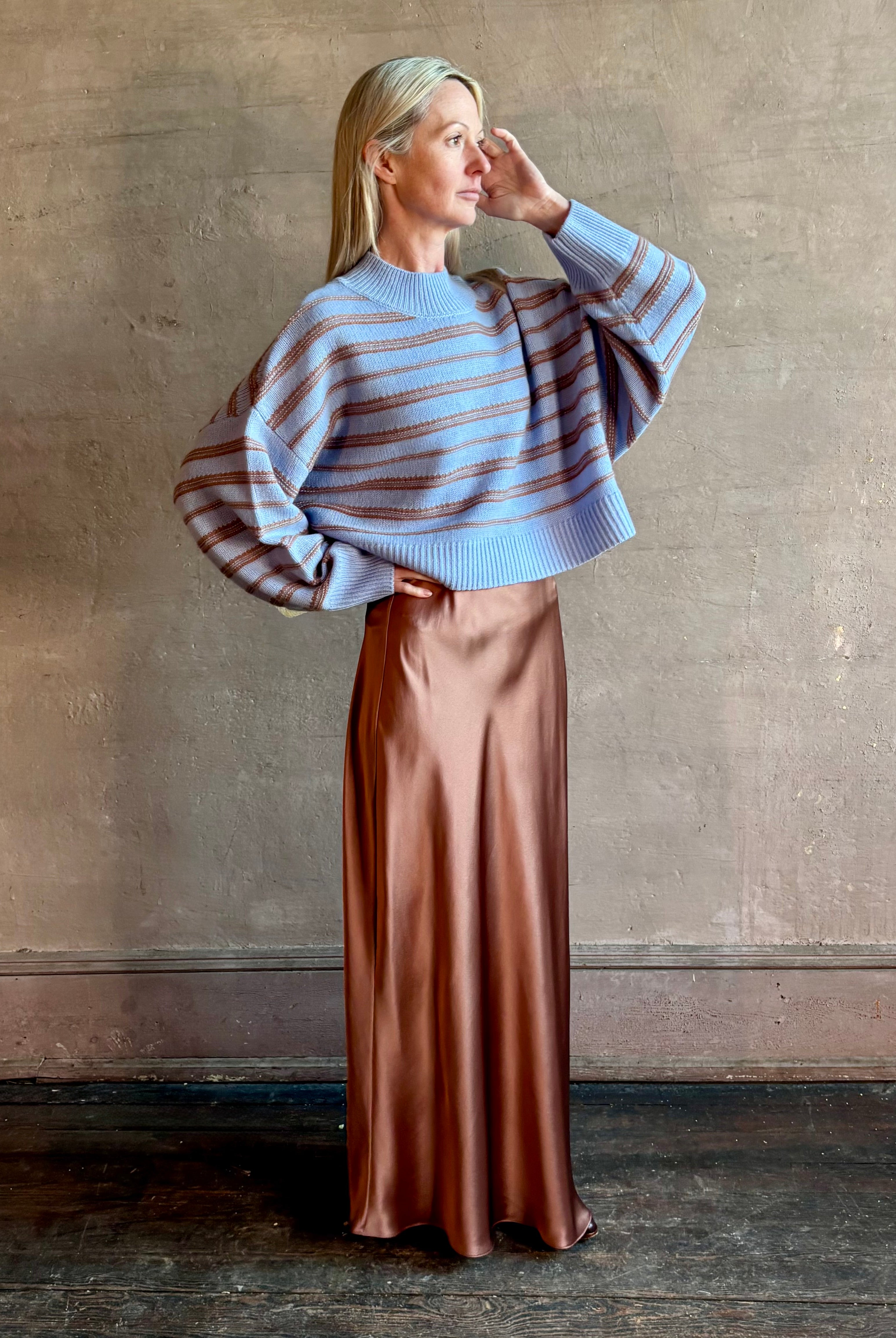 Woman wearing oversized SABLYN Wells B Cropped Pullover Sweater in Azureous Multi with drop shoulders