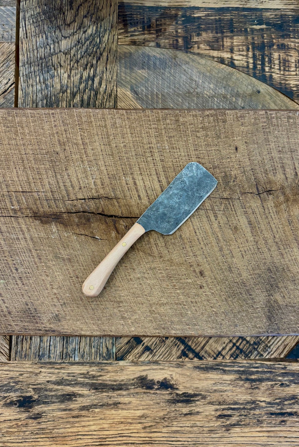 A small rustic modern charcuterie serving knife set with hand-forged steel blade and a walnut wooden handle hand crafted in USA