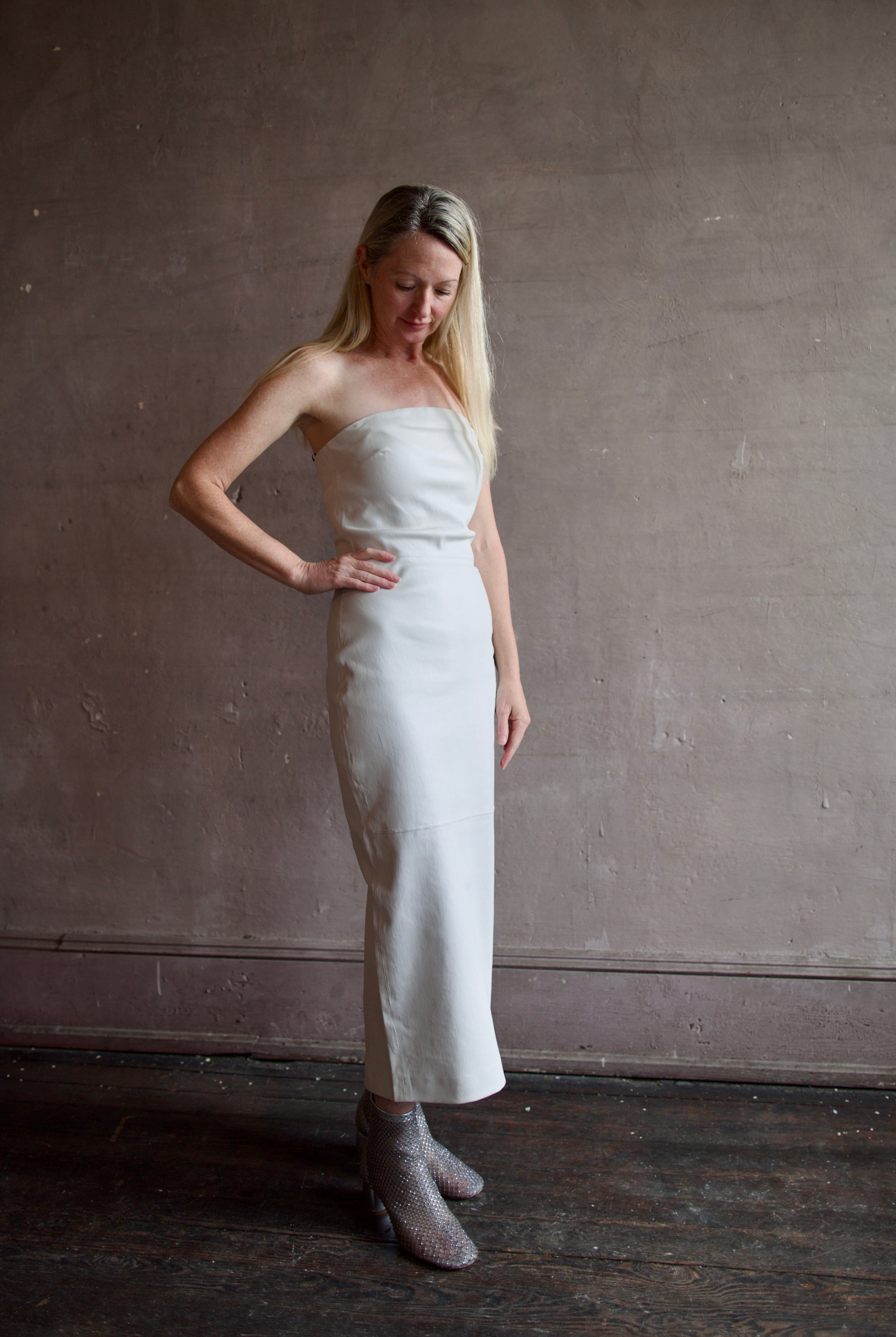 Model wearing SPRWMN Shell White Tube Dress - Designer Strapless Stretch Leather Midi