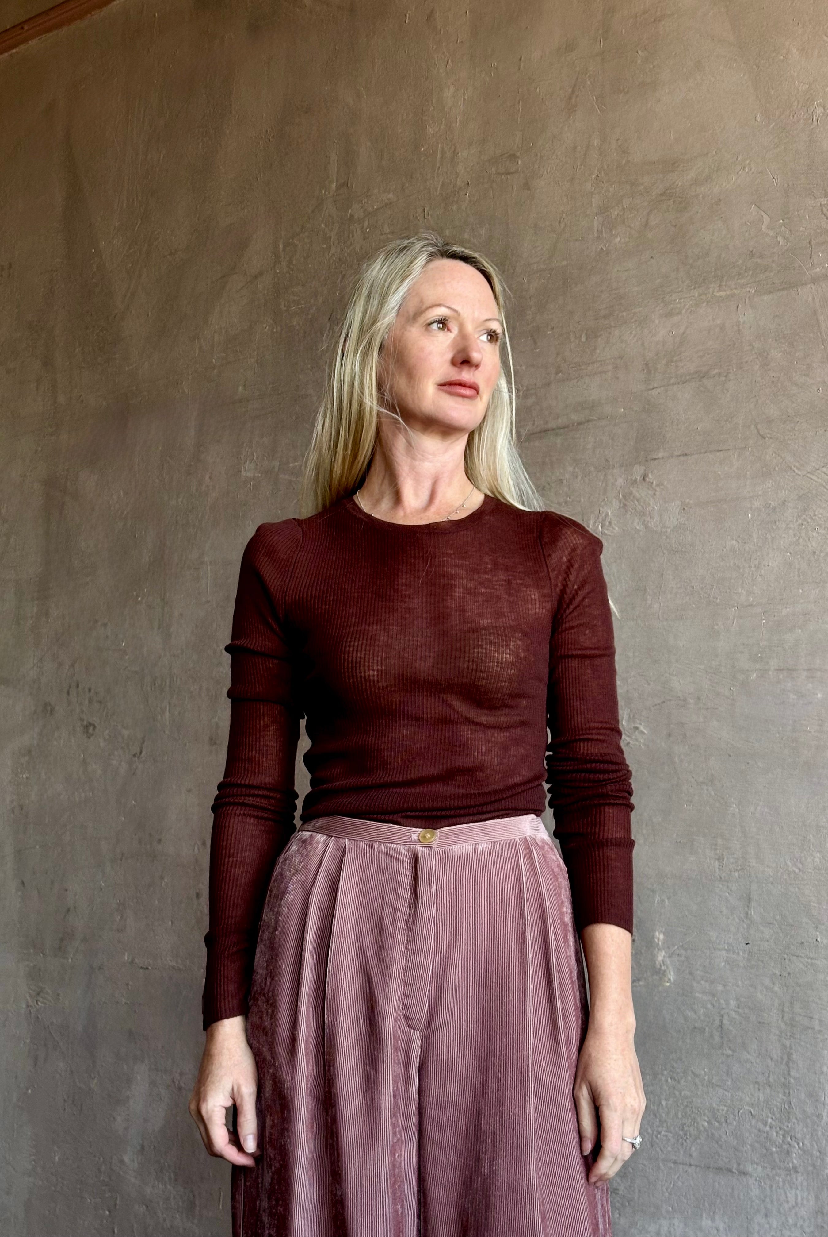 Image of mature woman wearing a lightweight long sleeve crew neck chocolate brown wool knit by SPRWMM