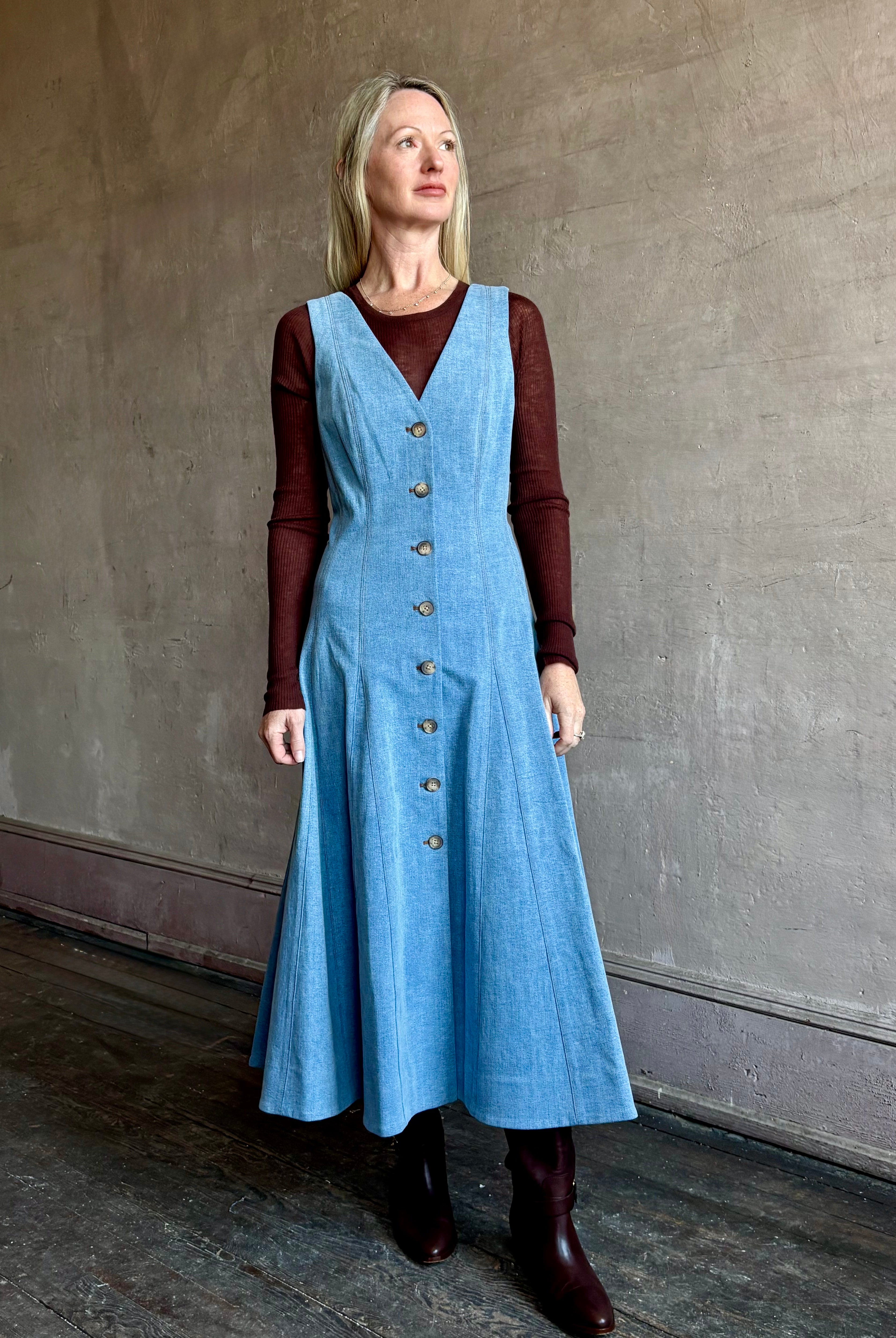 Image of mature woman wearing luxurious long sleeve layering wool top in premium brown wool knit by SPRWMM