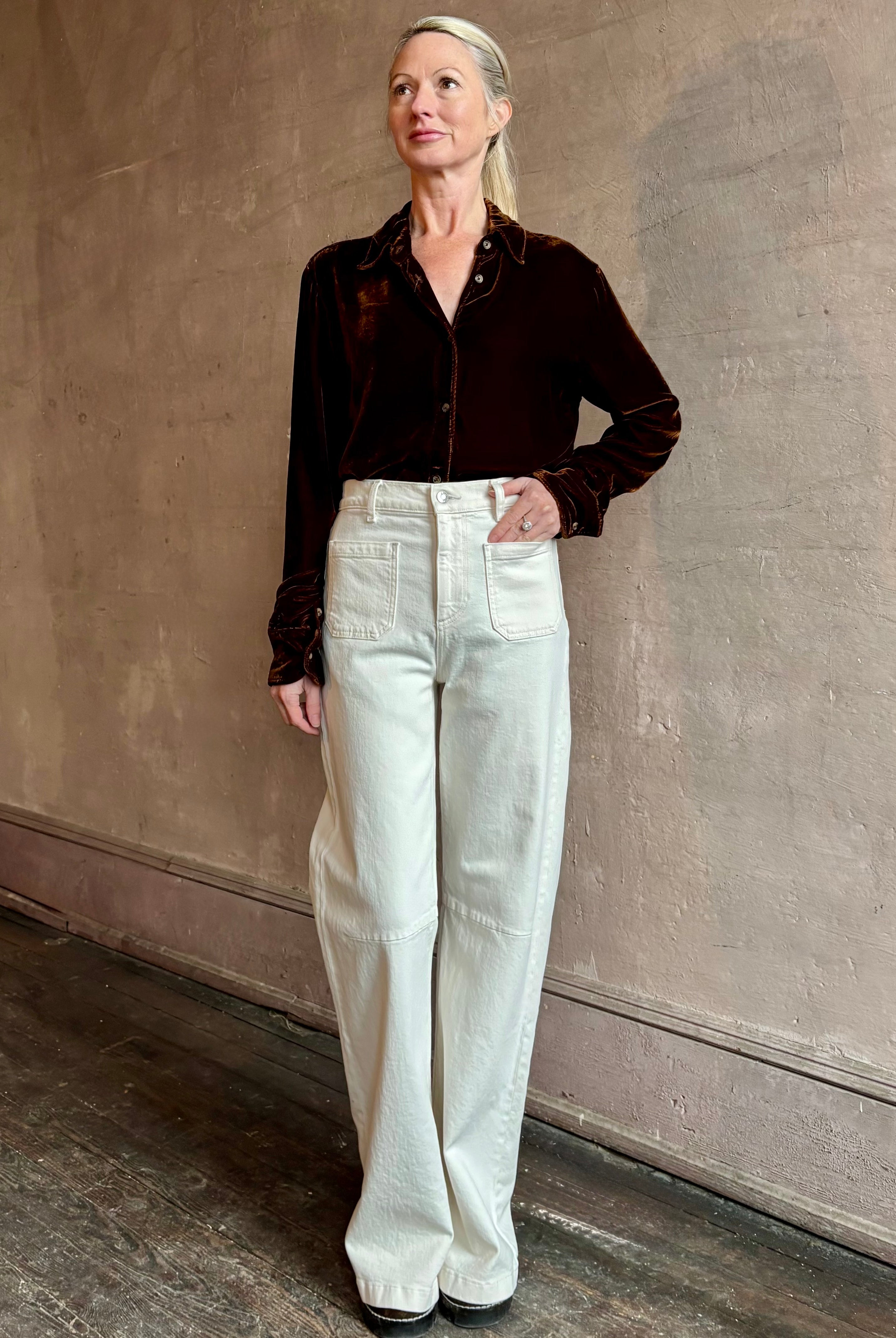 Woman wearing elevated American made SPRWMN Elise silk blend velvet Button Up To with long sleeves and collar