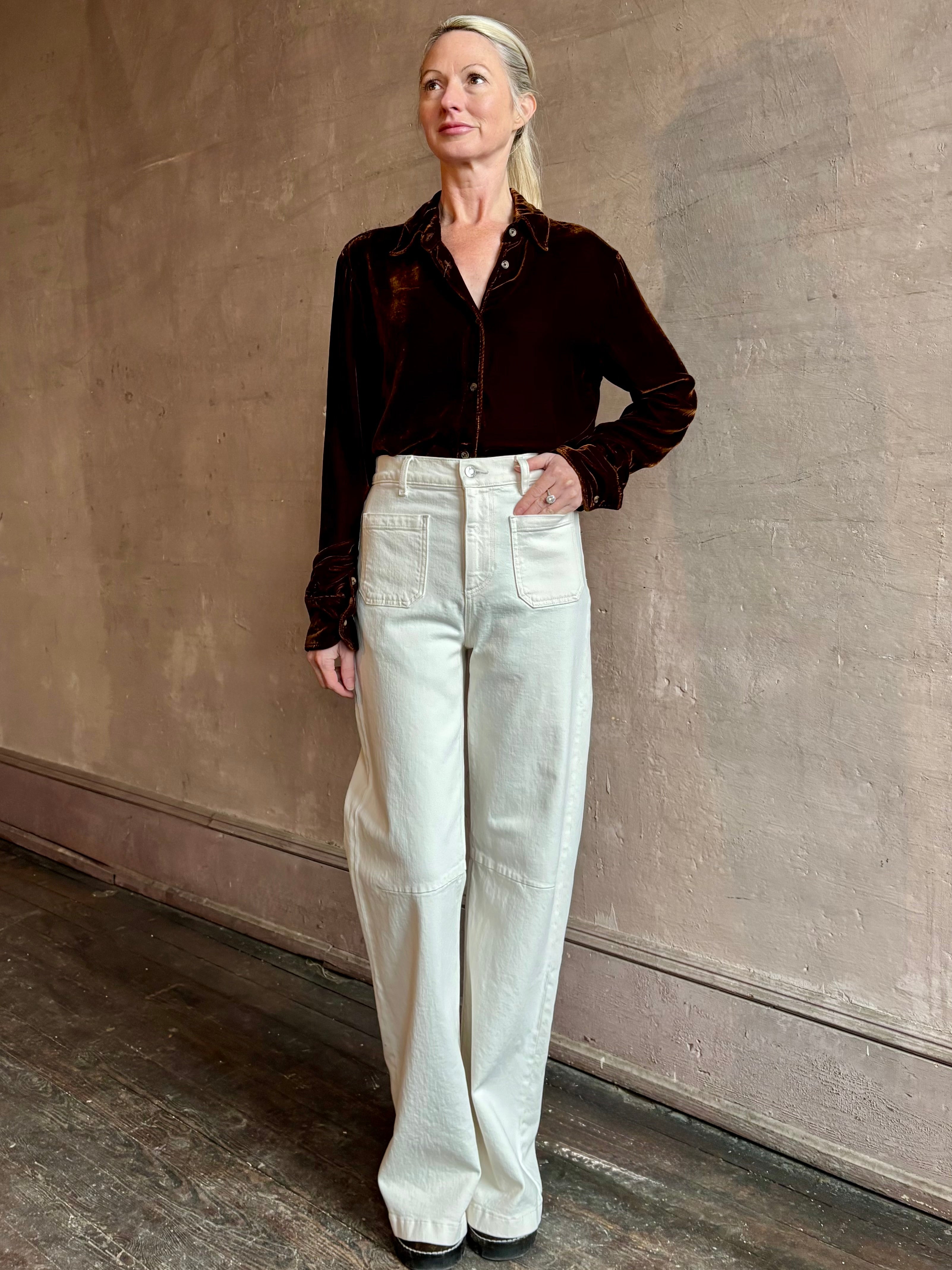 Woman wearing elevated American made SPRWMN Elise silk blend velvet Button Up To with long sleeves and collar