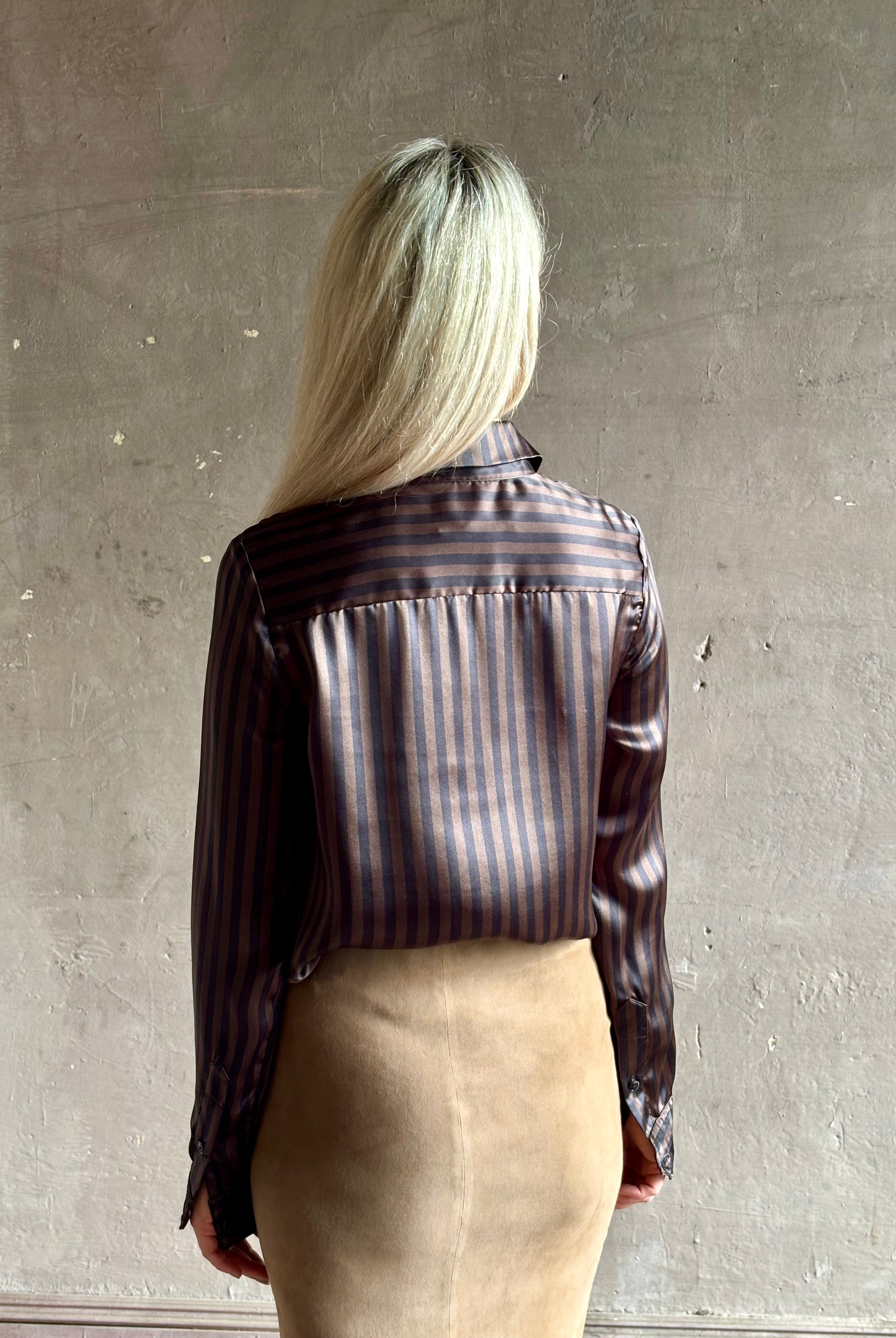 woman wearing luxury brand SPRWMN Fonda silk button up shirt in a black and brown stripe modern classic