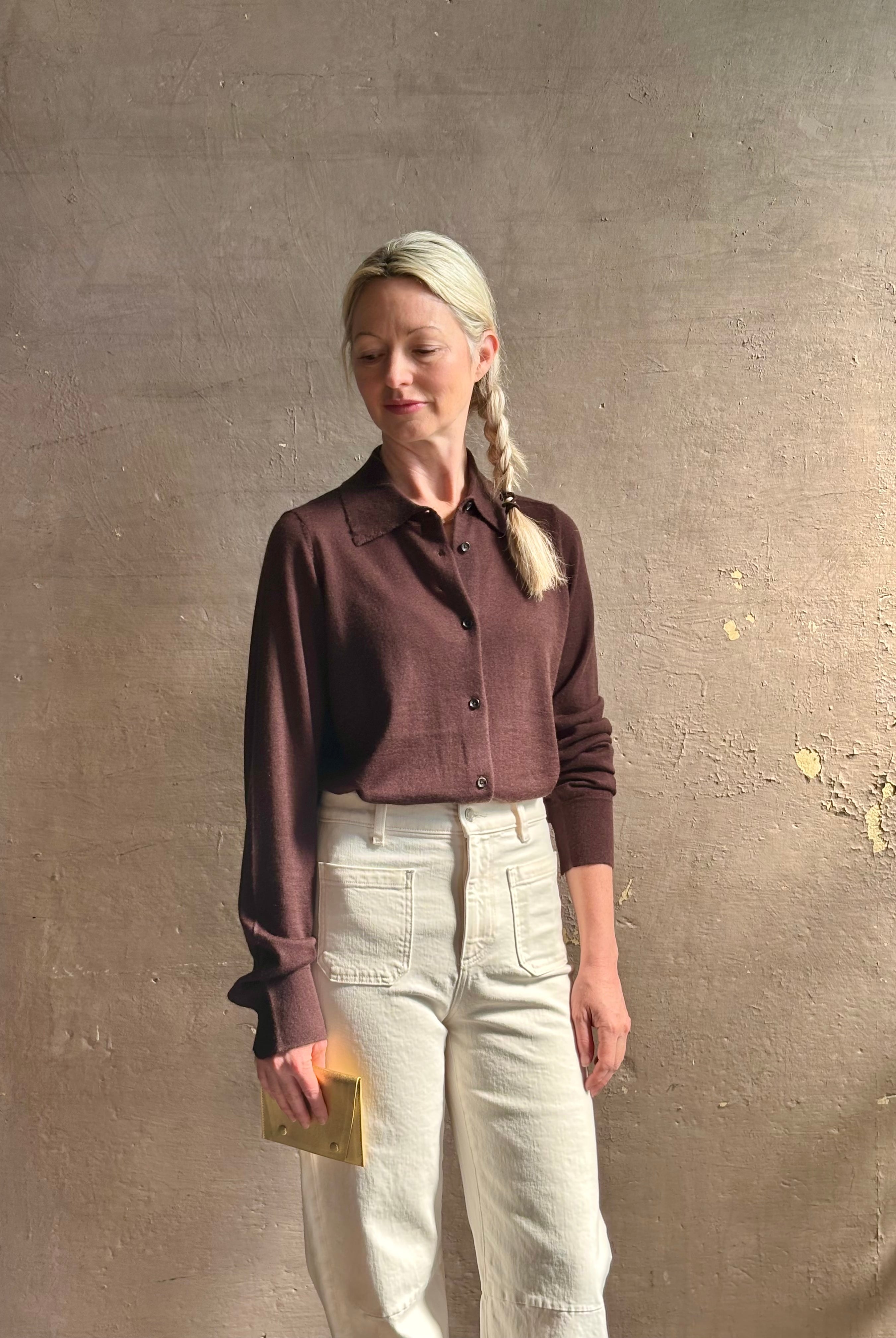Mature woman wearing elevated casual wear button front Fonda top by SPRWMN in chocolate brown cashmere with long sleeves and a collar
