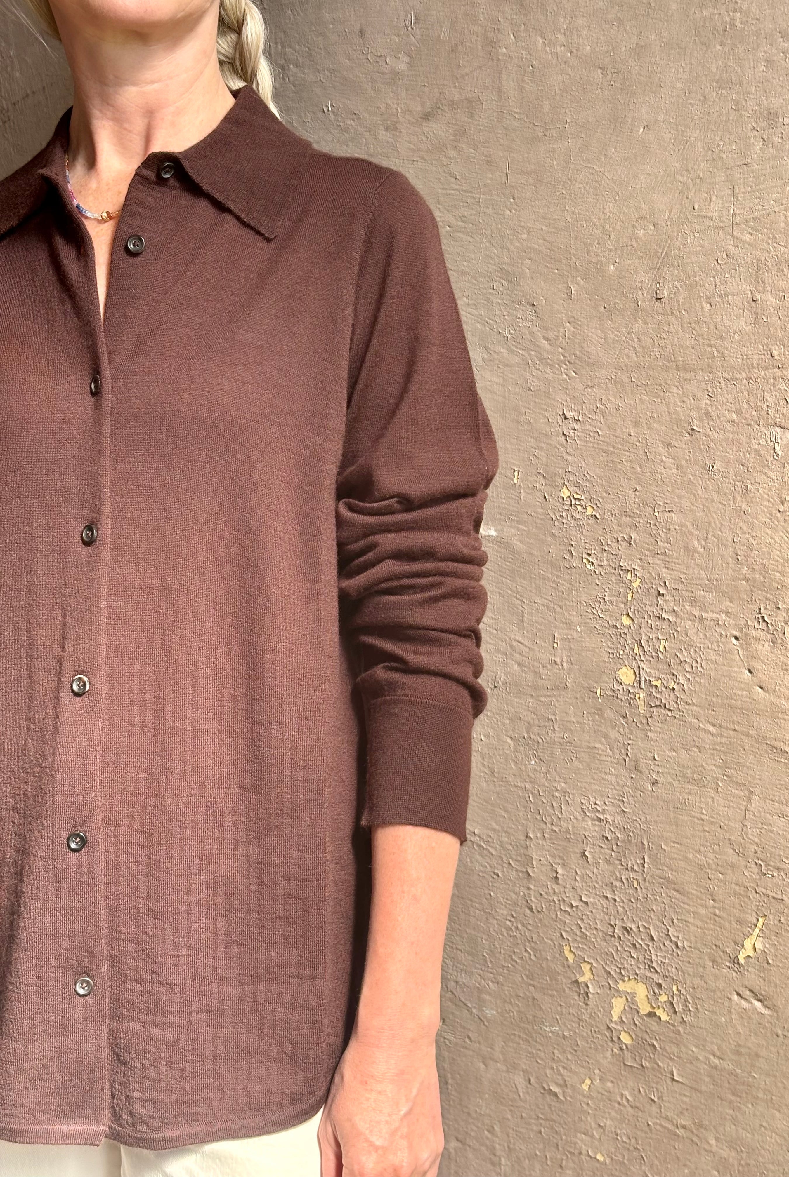 Mature woman wearing elevated casual wear button front Fonda top by SPRWMN in chocolate brown cashmere with long sleeves and a collar