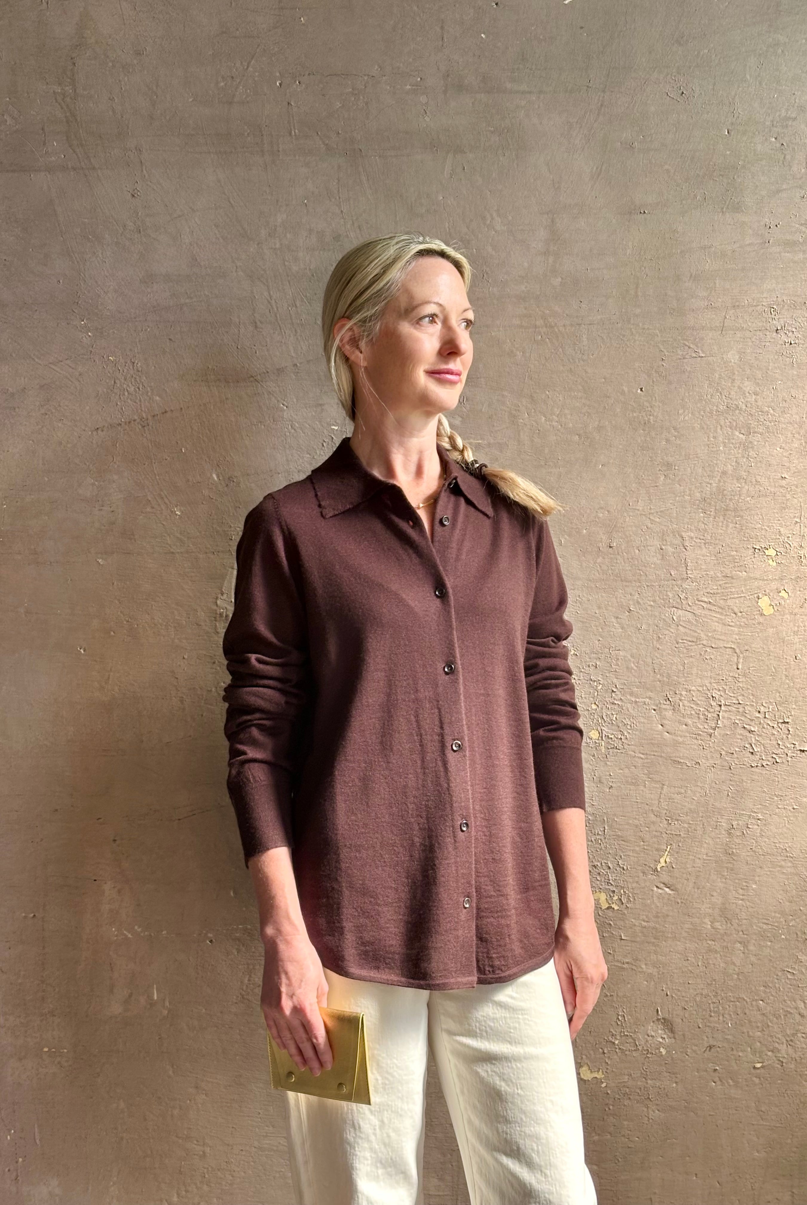 Mature woman wearing elevated casual wear button front Fonda top by SPRWMN in chocolate brown cashmere with long sleeves and a collar