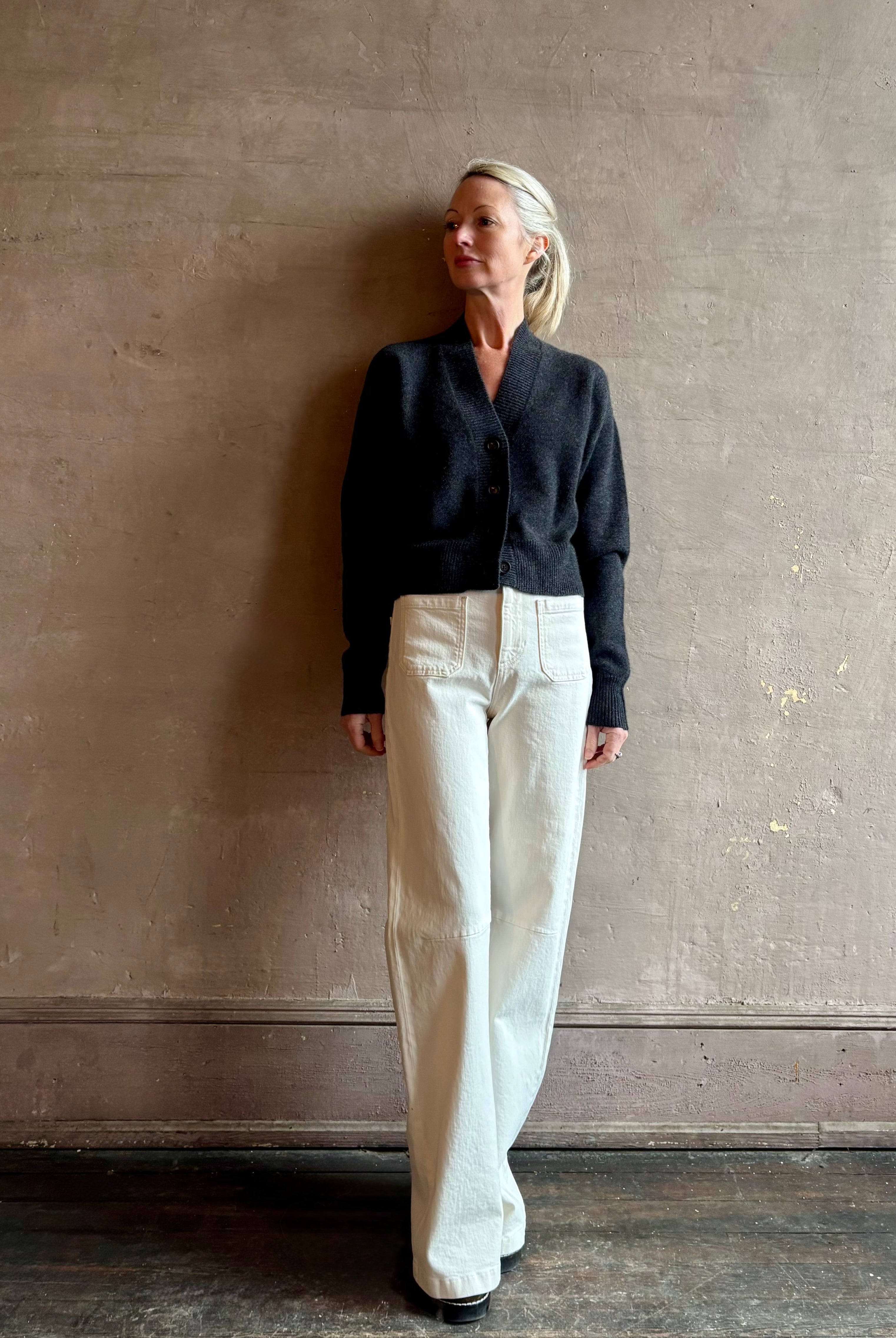 Swoman wearing PRWMN Mia Cardigan with 3 button closure and v-neck modest enough to wear alone or layering