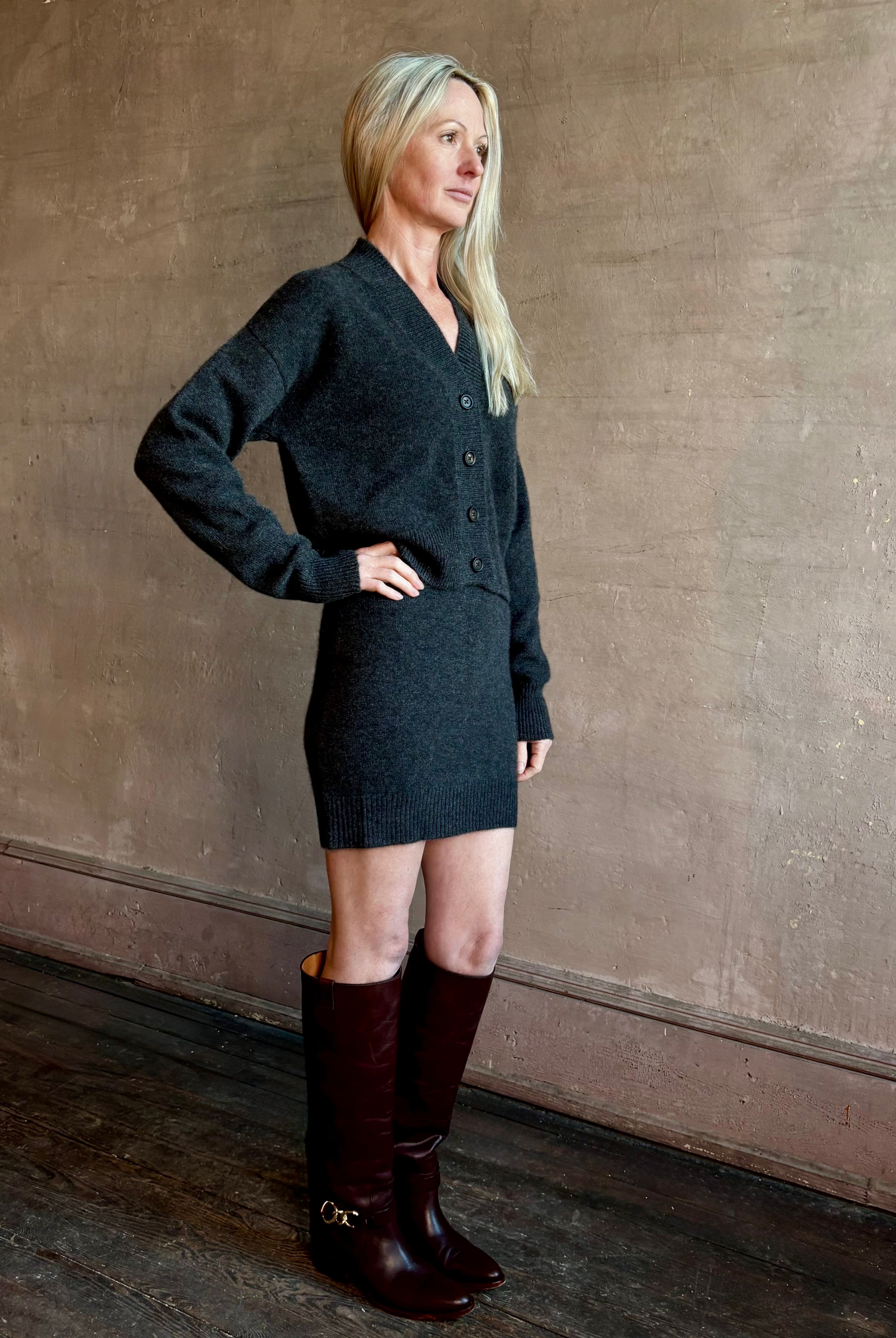 Image of woman wearing a luxury cashmere knitwear set from SPRWMN in charcoal grey