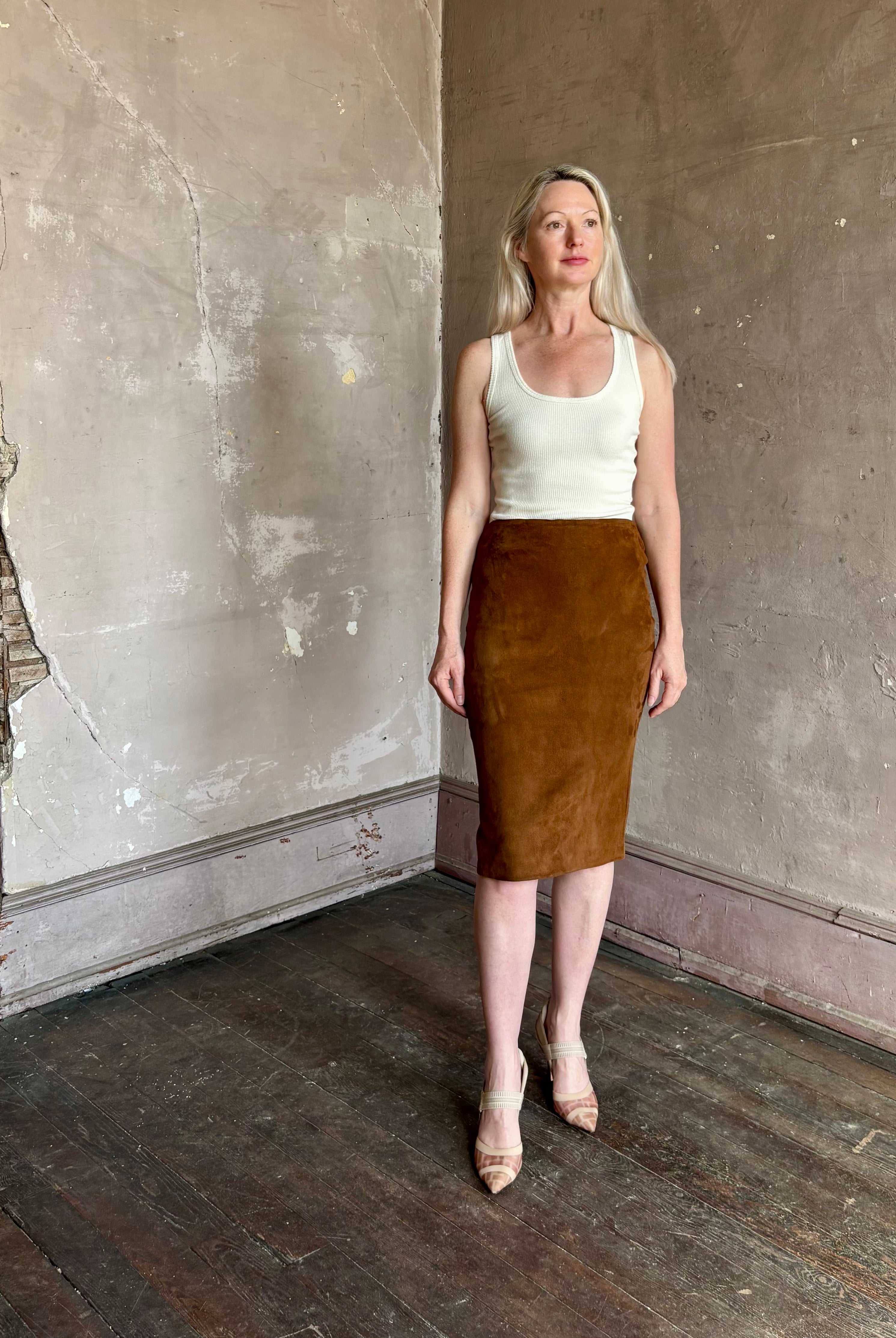 mature woman wearing contemporary designer SPRWMN brown suede leather pencil skirt medium brown