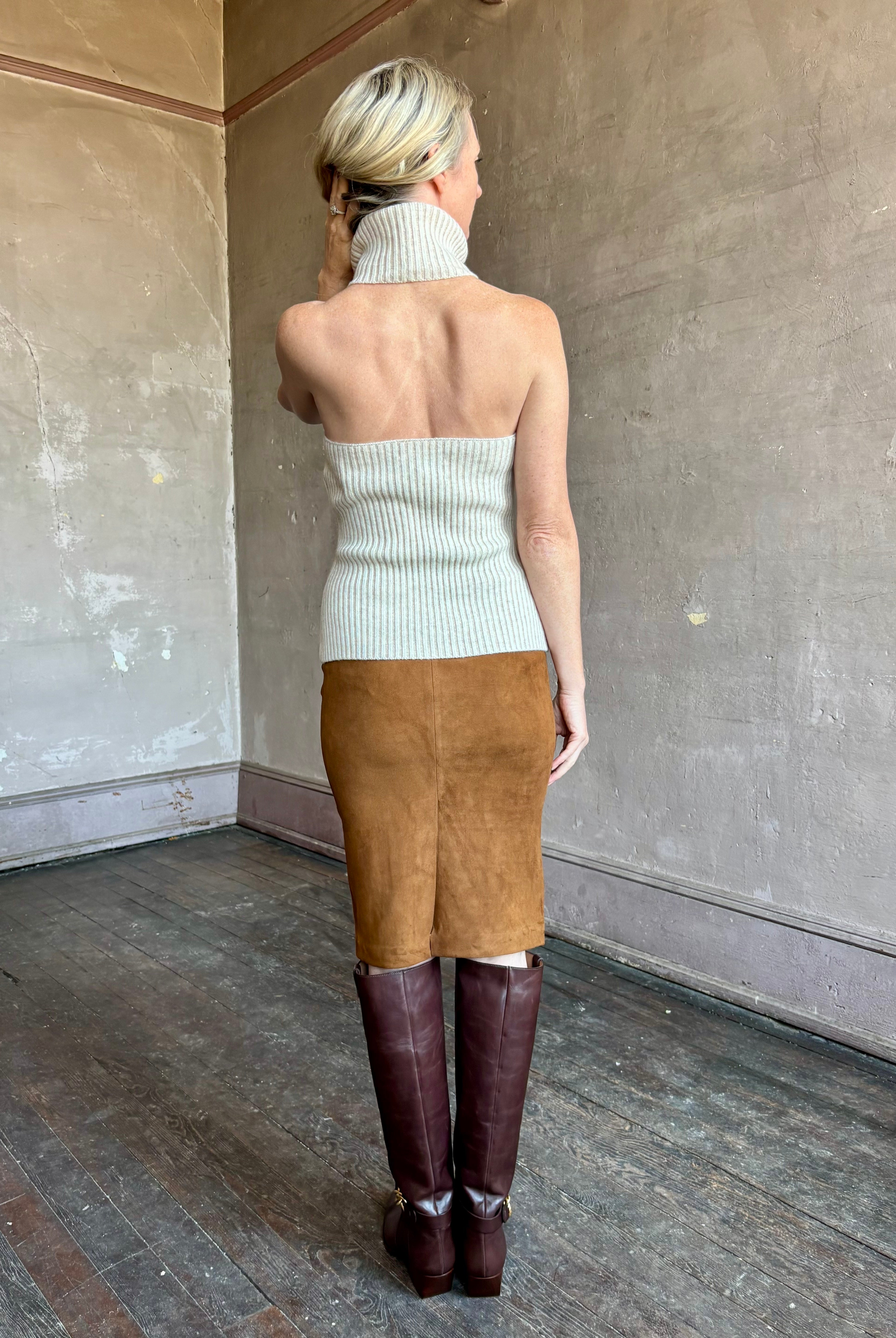 Image of mature woman wearing contemporary designer SPRWMN brown suede leather pencil skirt with back vent