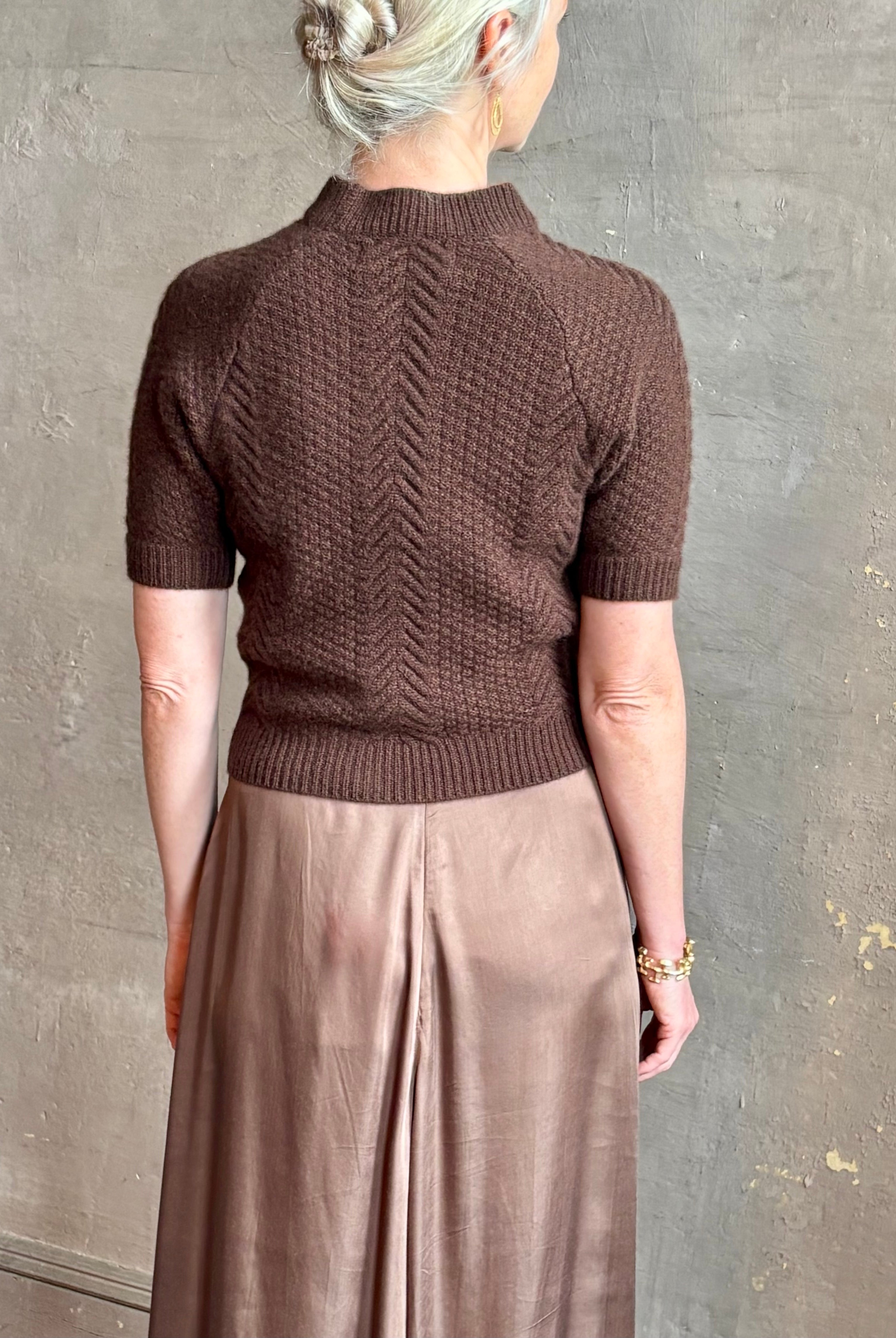 mature woman wearing luxury designer SPRWMN short sleeve brown cashmere sweater with cable texture crew neck