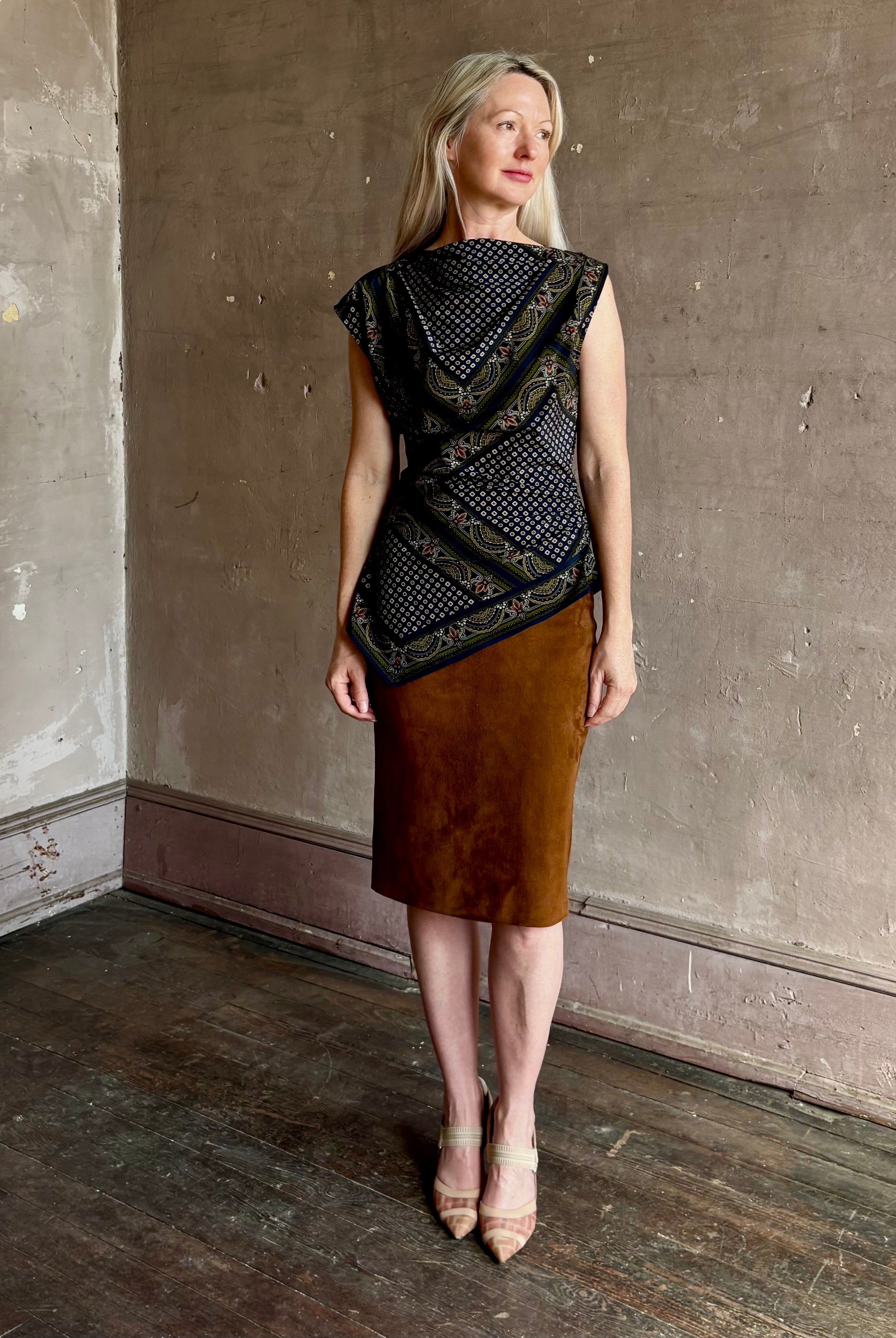 mature woman wearing contemporary designer SPRWMN brown suede leather pencil skirt medium brown