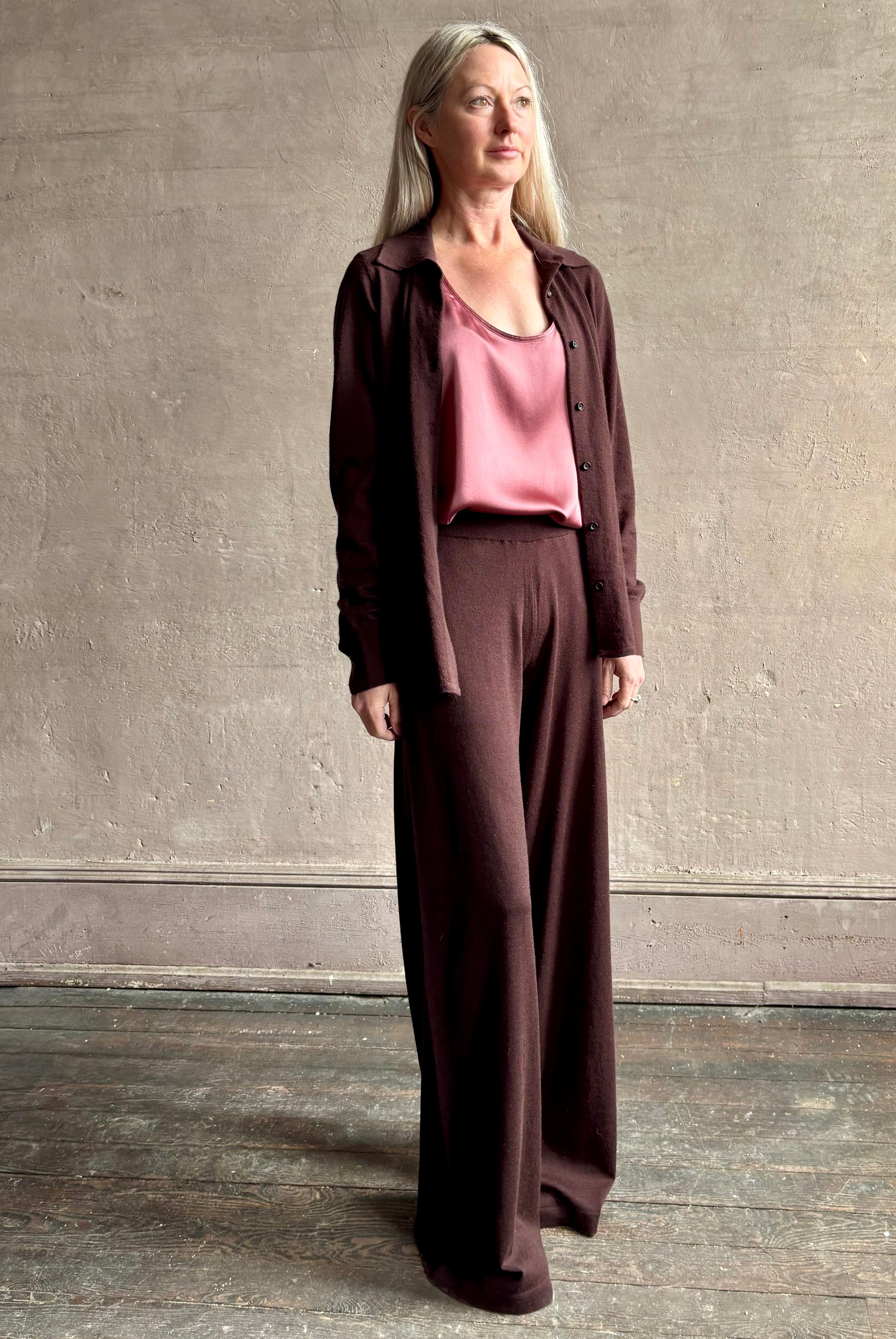 mature woman wearing SPRWMN premium knit cashmere brown pant elastic waistband mid-rise wide leg