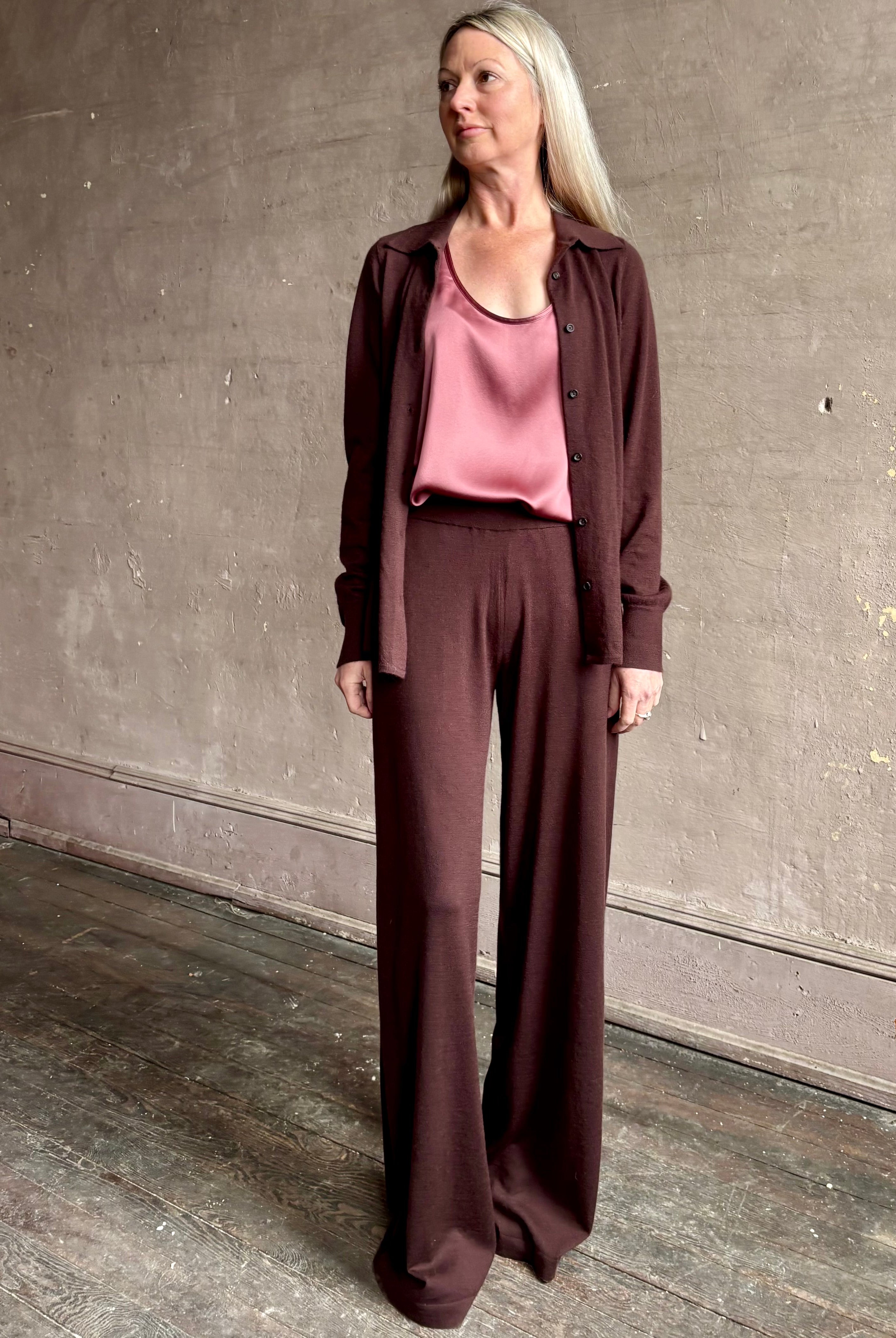 mature woman wearing SPRWMN premium knit cashmere brown pant elastic waistband mid-rise wide leg