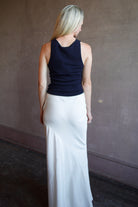Model wearing luxury brand Sablyn Addyson v-neck layering tank in super fine merino wool for exceptional lightweight comfort