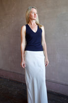 Model wearing luxury brand Sablyn Addyson v-neck layering tank in super fine merino wool for exceptional lightweight comfort
