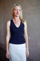 Model wearing luxury brand Sablyn Addyson v-neck layering tank in super fine merino wool for exceptional lightweight comfort