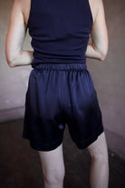 Back image of a woman wearing the Sablyn Brynn Shorts and Addyson Layering Tank