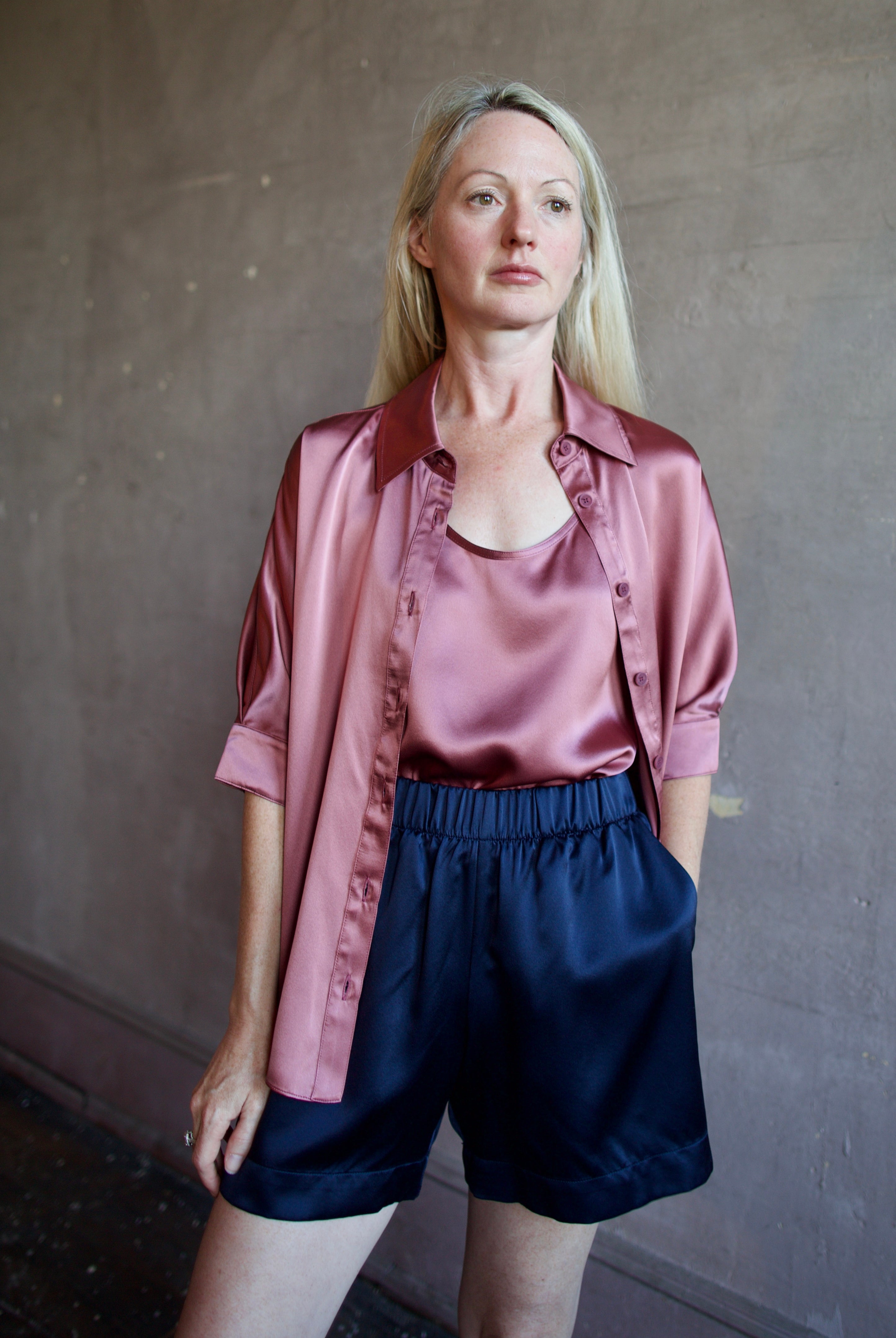 Image of a woman wearing the Sablyn Brynn Shorts, Claudia B Scoop Tank and Gisele B Button Down