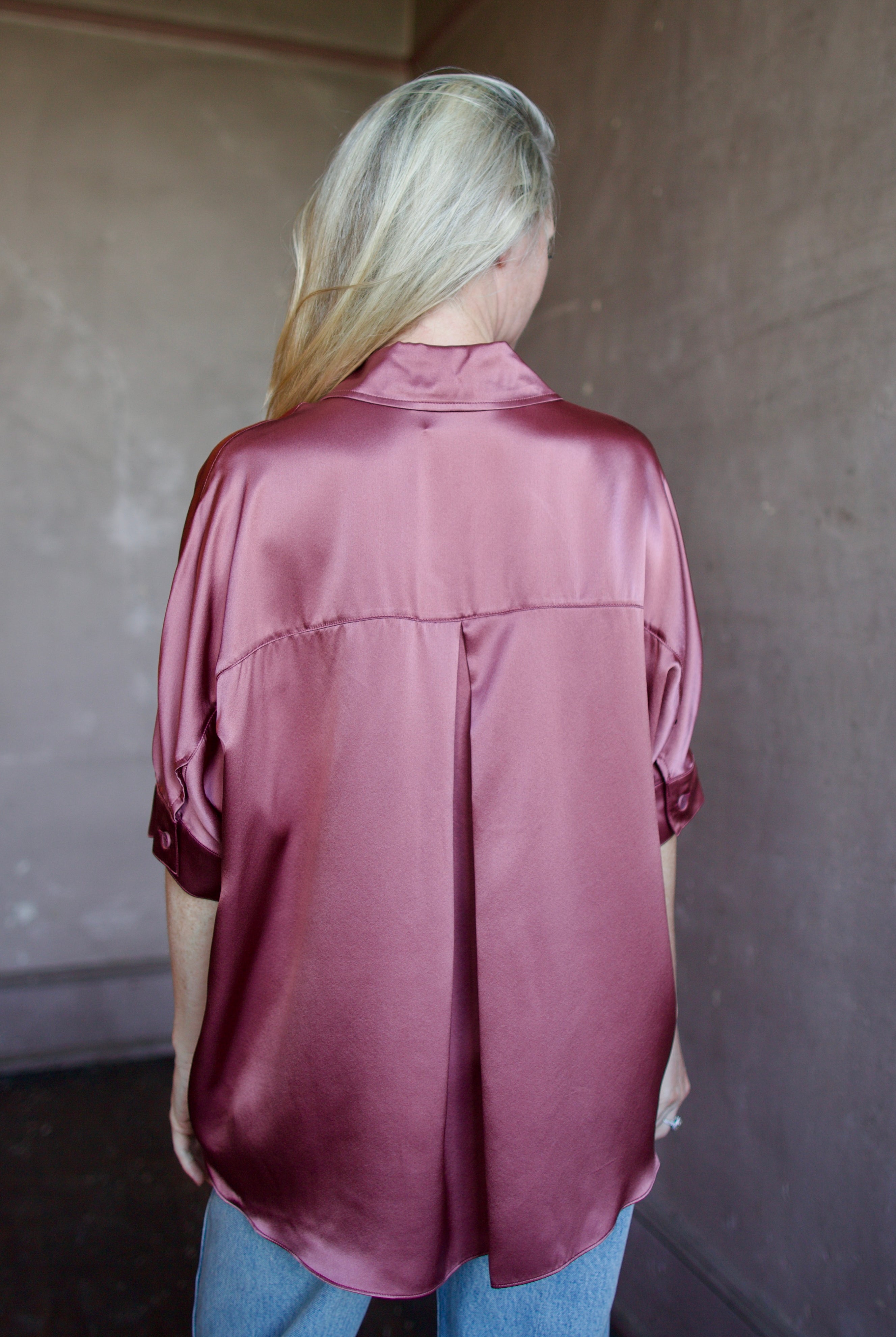 Model wearing luxury designer Sablyn silk charmeuse Gisele B relaxed short sleeve button down blouse with collar