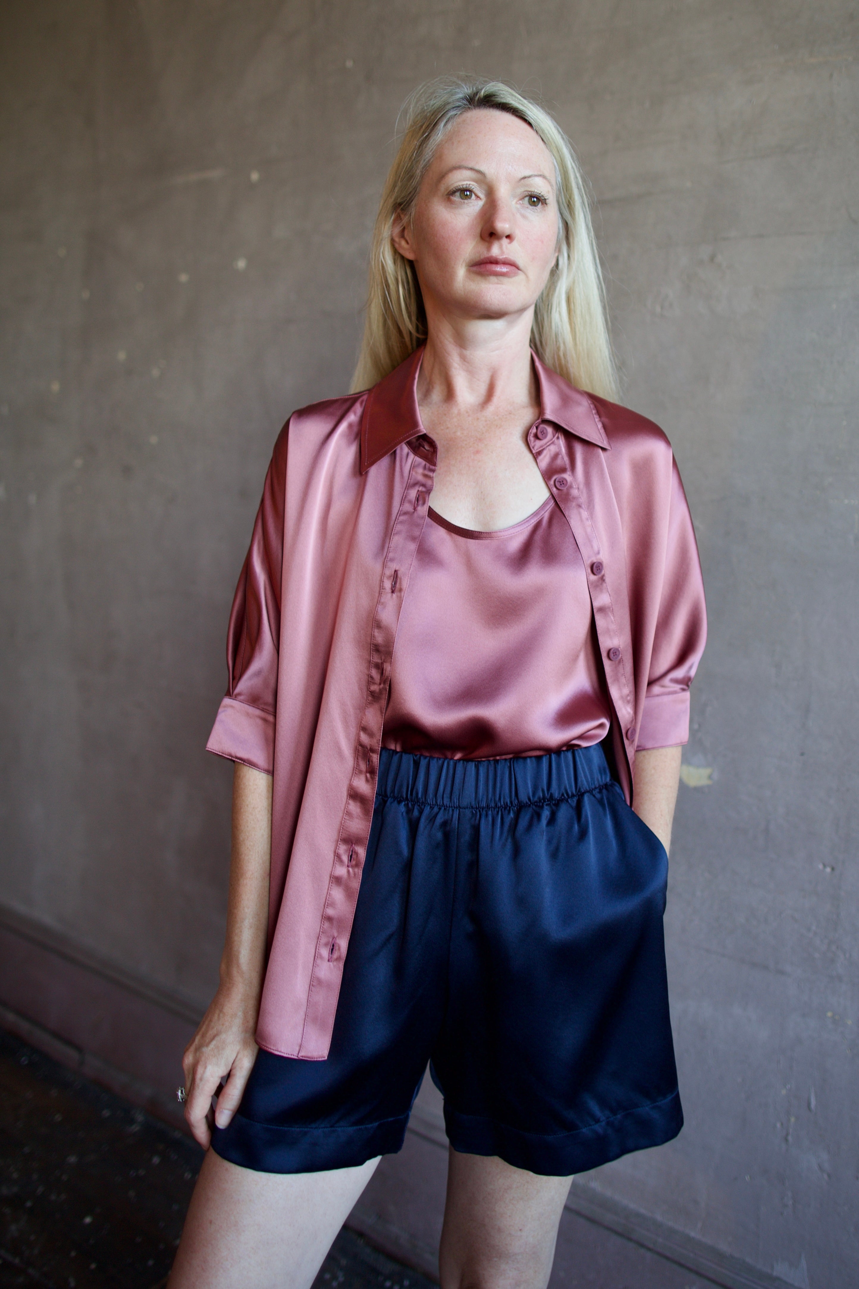 Model wearing luxury designer Sablyn silk charmeuse Gisele B relaxed short sleeve button down blouse with collar