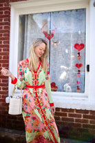 Woman wearing premium silk  Saloni Lea Dress in Florentina Gardeni happy colorway with v-neckline and button front shirt dress