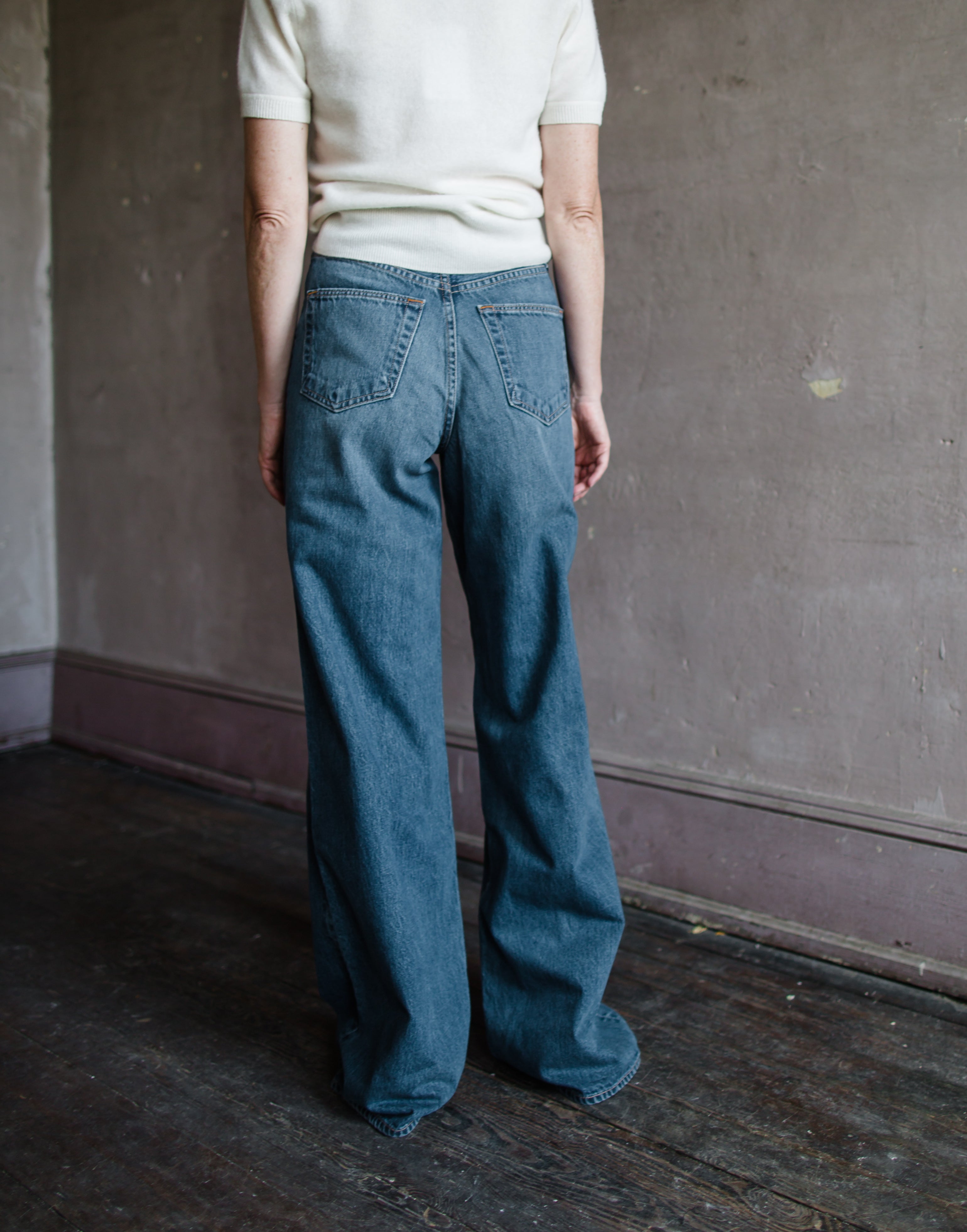 Back view of Woman wearing Slvrlake Eva high rise wide leg denim jeans in Trip to Tulsa wash