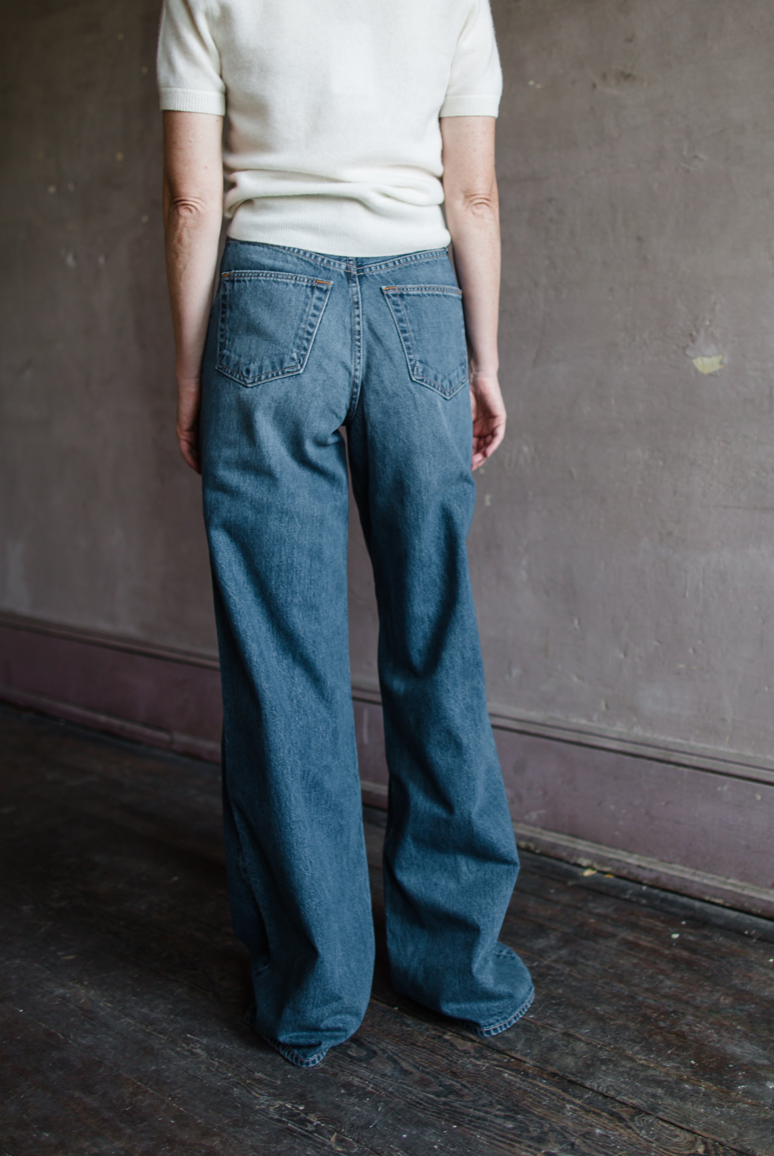 Woman wearing Slvrlake Eva high rise wide leg rigid cotton denim jeans in Trip to Tulsa Wash 34" Long Inseam