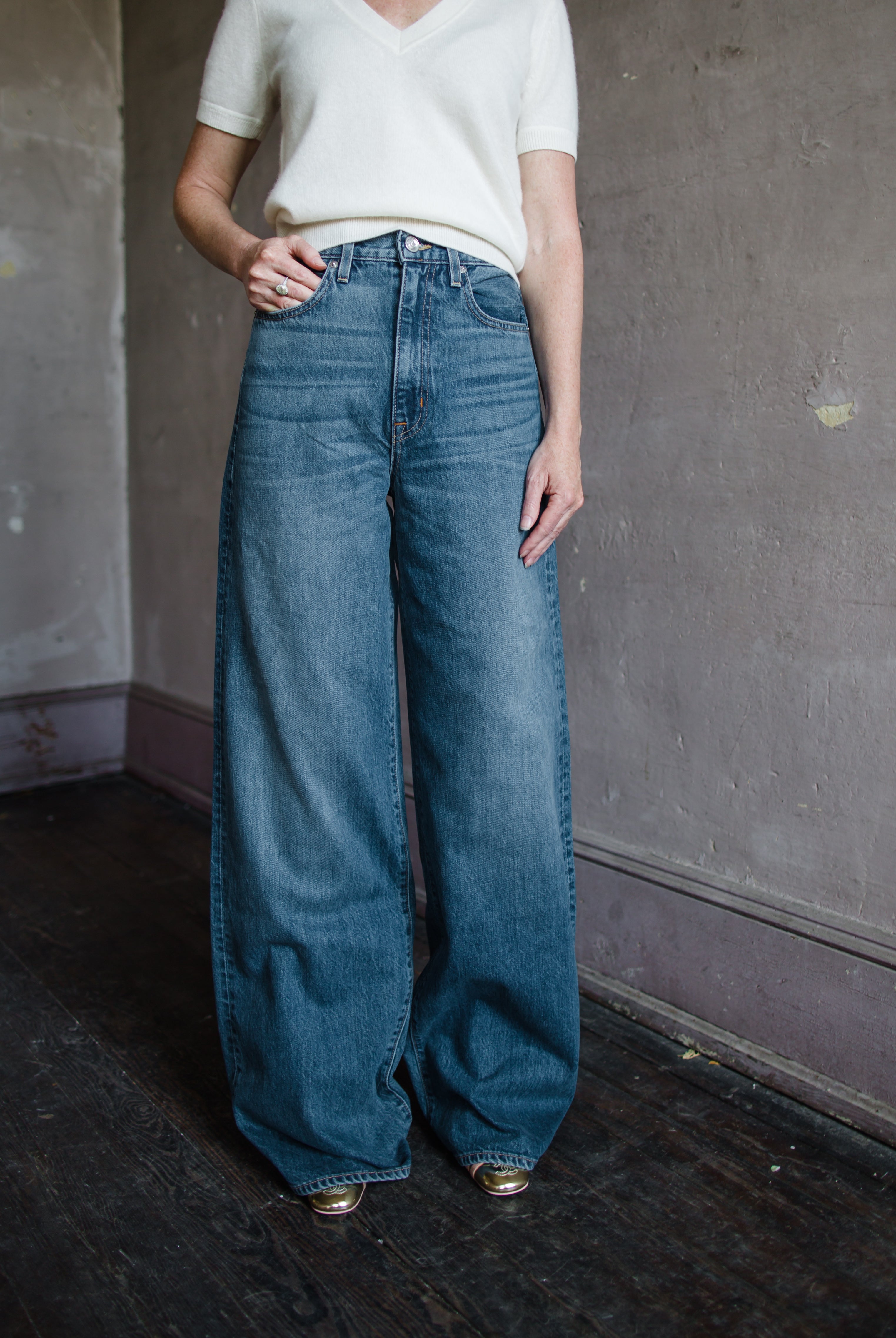 Woman wearing Slvrlake Eva high rise wide leg denim jeans in Trip to Tulsa wash