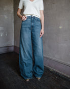 Woman wearing Slvrlake Eva high rise wide leg denim jeans in Trip to Tulsa wash