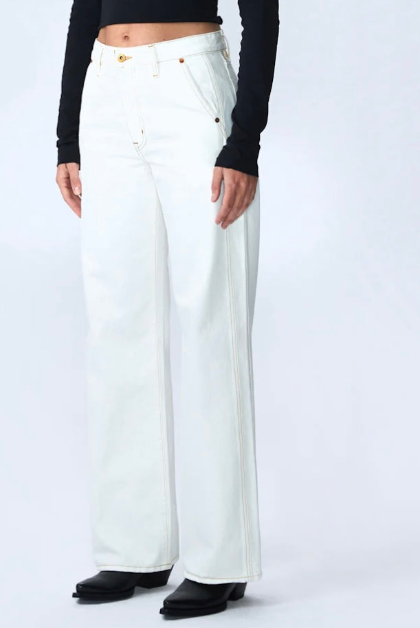 Image featuring a woman wearing he Grace Slvrlake cotton rigid denim high-rise, wide leg jeans with a double side seams, slanted side pockets in ecru.