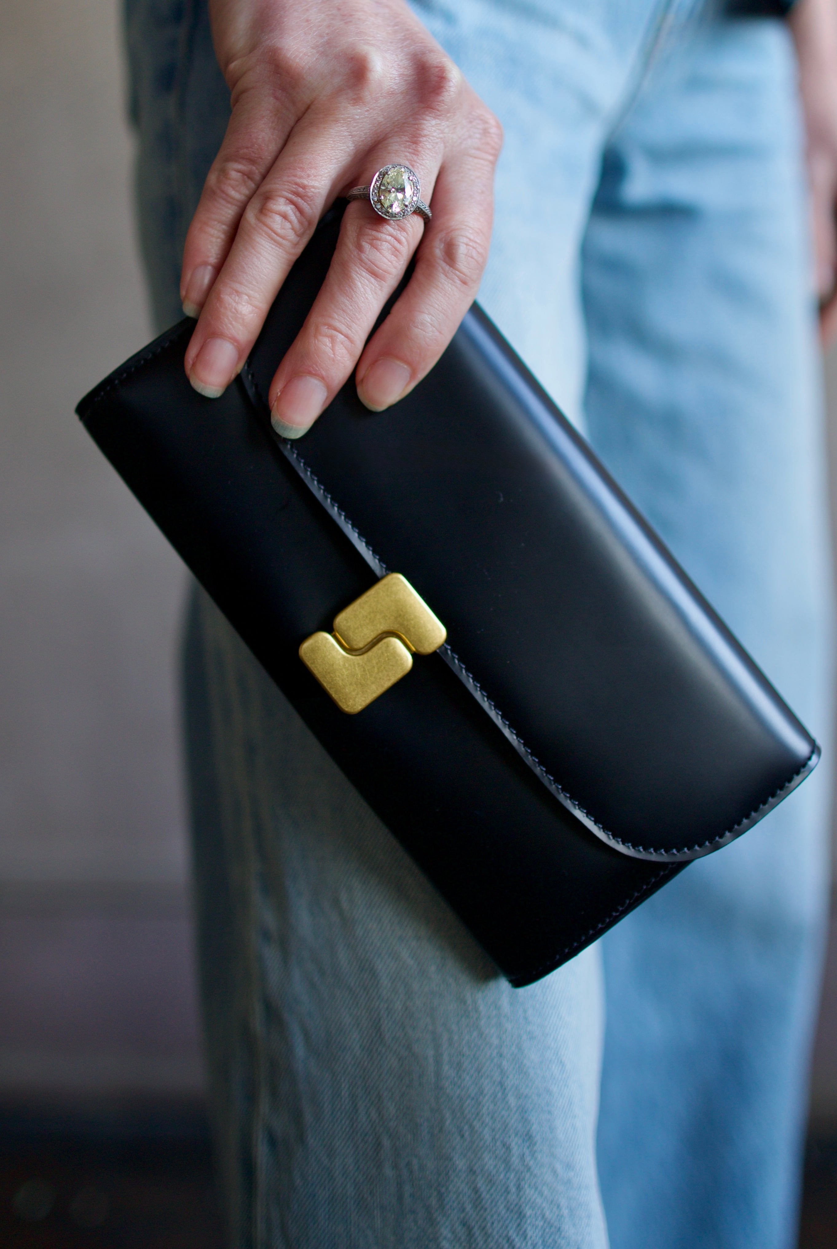 Image of luxury women's black leather Soeur Anita Wallet featuring magnetic closure with multiple card compartments and interior zip pouch