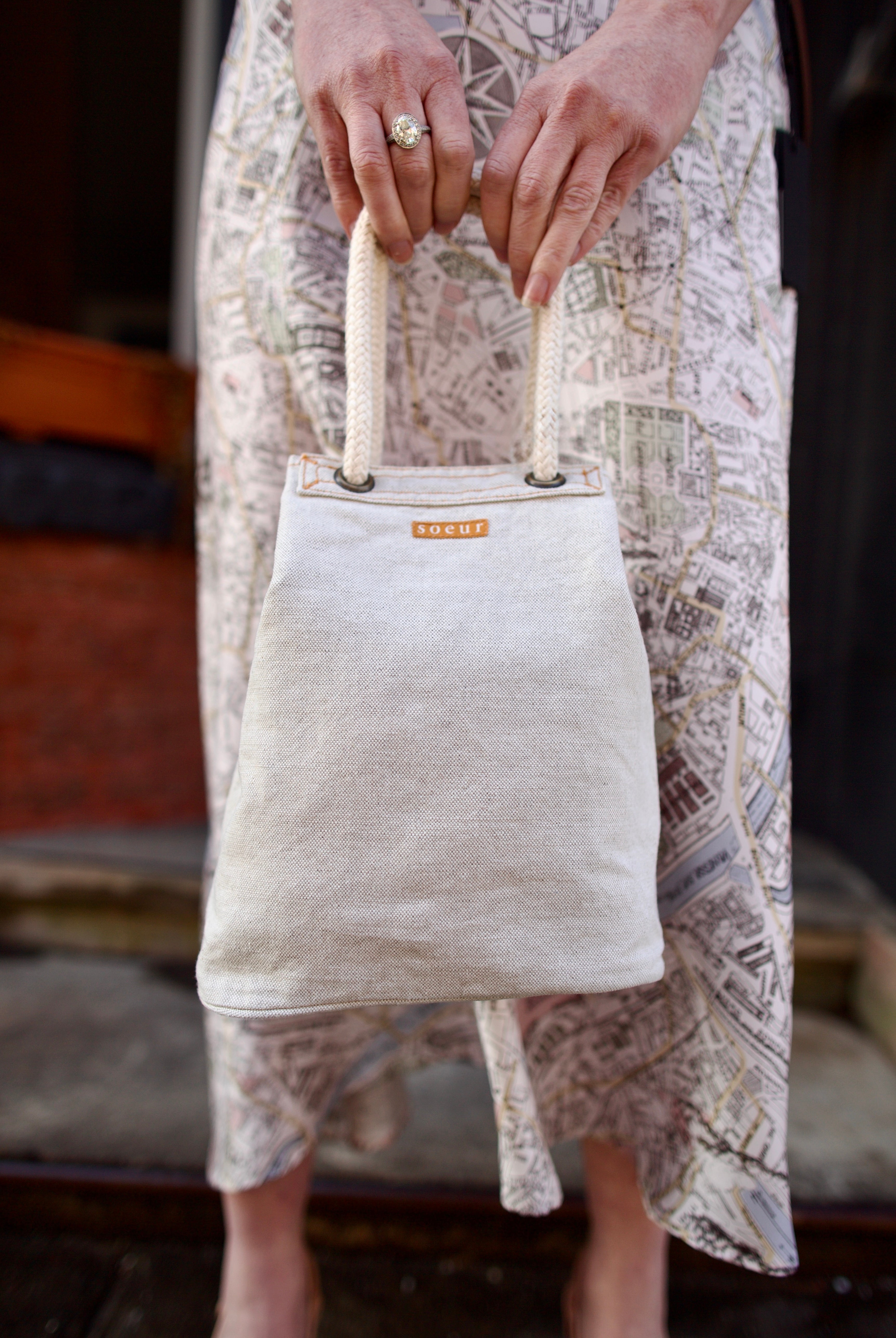 Photo of Soeur Dave handbag with refined sophistication through premium cotton construction and expertly designed crescent silhouette