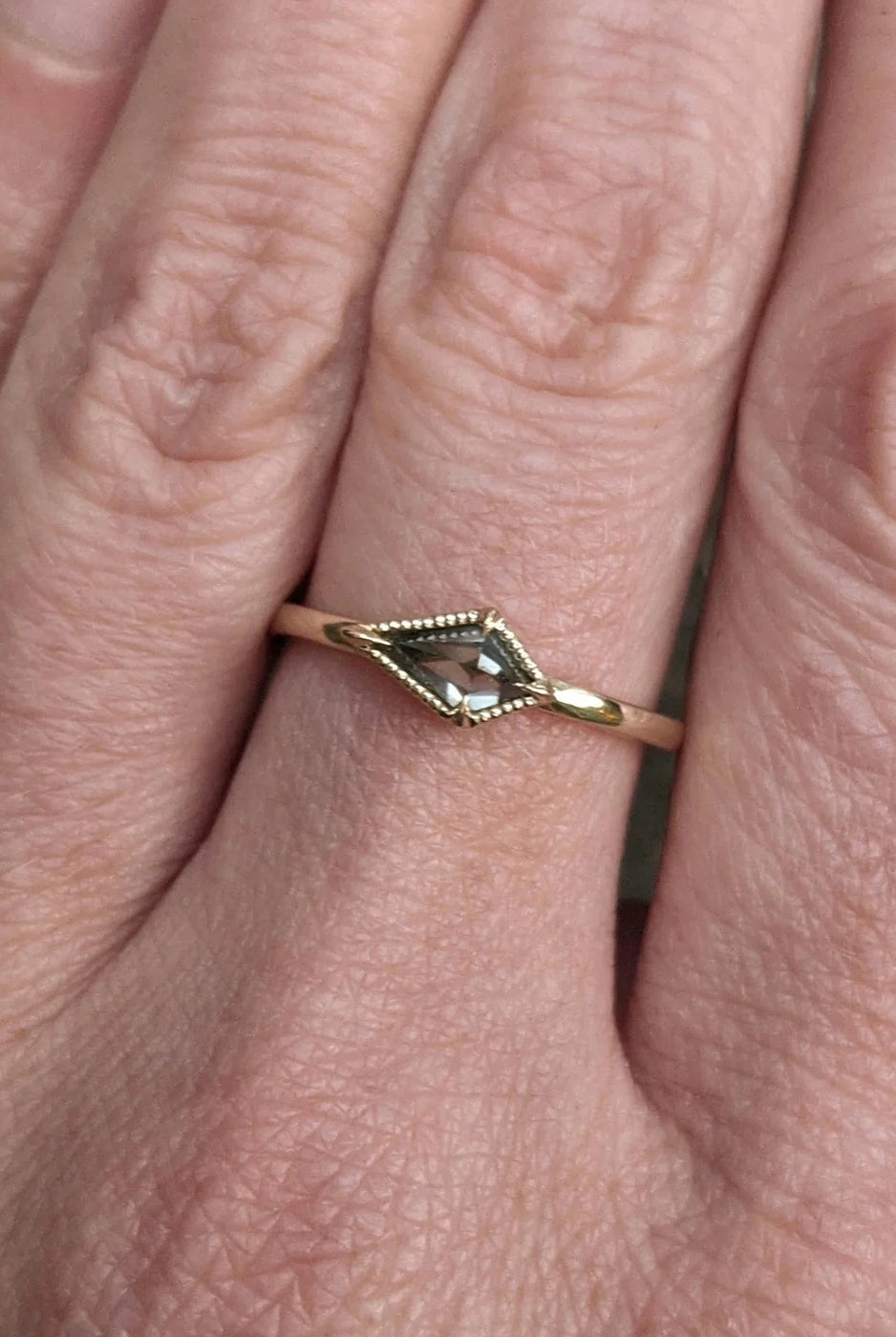 Image of North Carolina jewelry artist STEPHANIE ELLIS Diamond Kite Stacker Ring in 14K Recycled Yellow Gold and 0.4 carat Salt and Pepper Diamond