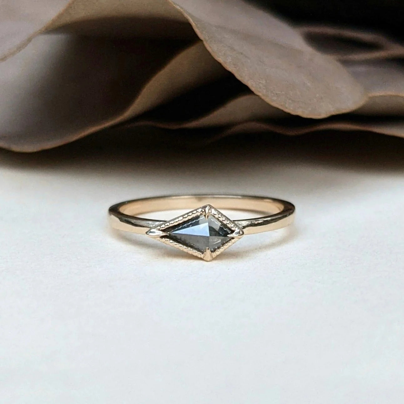 Image of North Carolina jewelry artist STEPHANIE ELLIS Diamond Kite Stacker Ring in 14K Recycled Yellow Gold and 0.4 carat Salt and Pepper Diamond