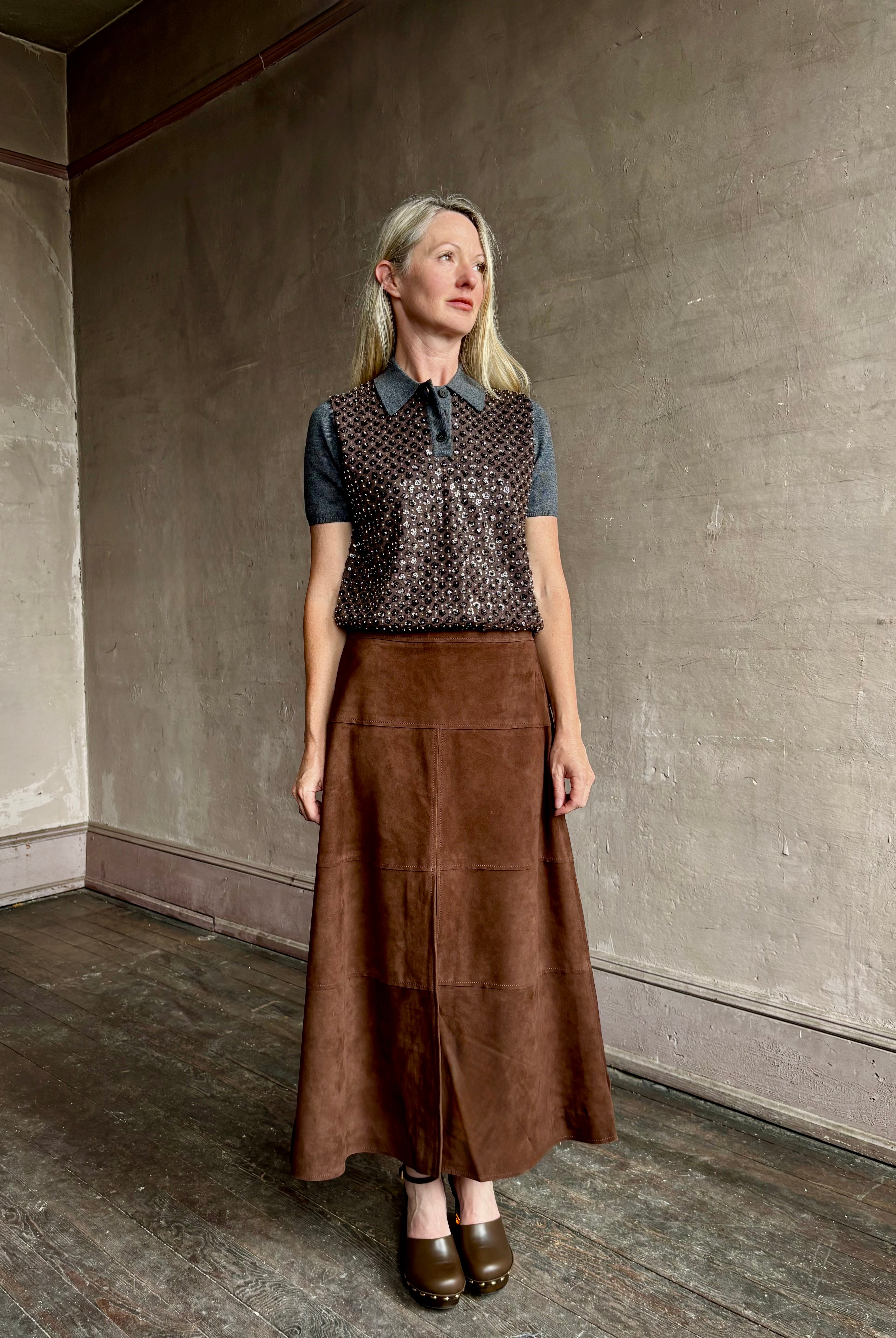 Image of mature woman wearing contemporary designer Tanya Taylor luxurious Suede classic A-Line Hudson Skirt in Chocolate brown