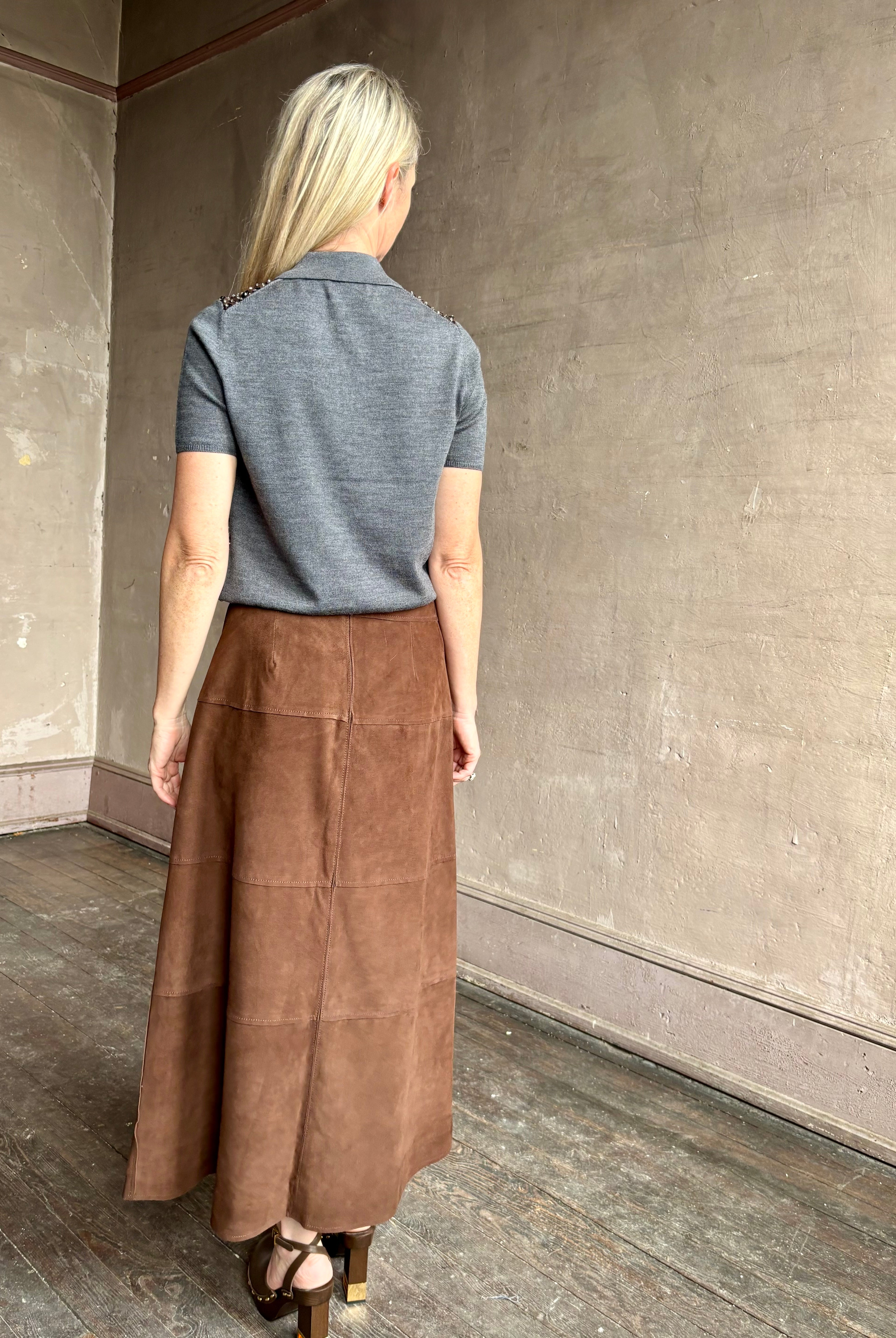 Image of mature woman wearing contemporary designer Tanya Taylor luxurious Suede classic A-Line Hudson Skirt in Chocolate brown
