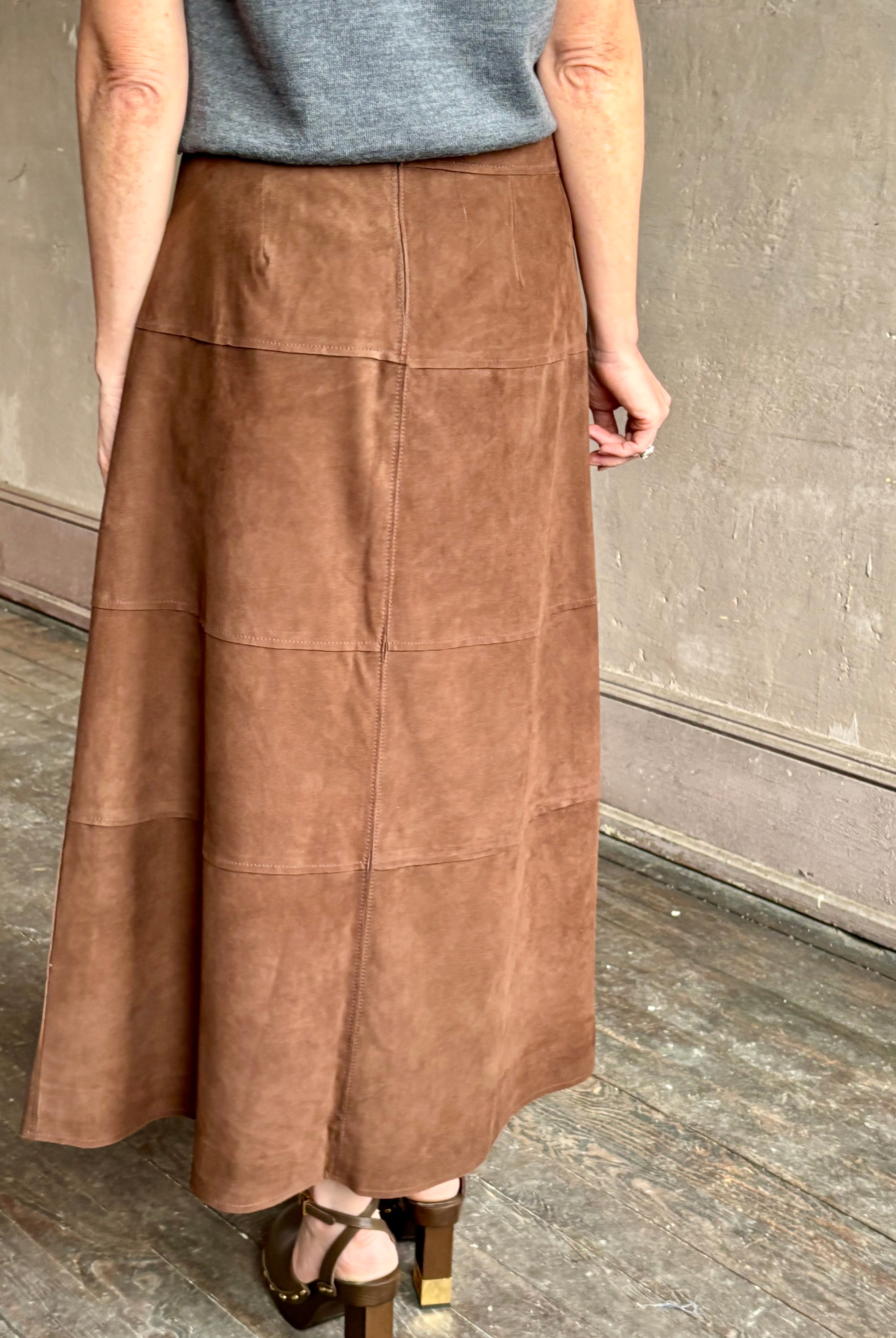 Image of mature woman wearing contemporary designer Tanya Taylor luxurious Suede classic A-Line Hudson Skirt in Chocolate brown