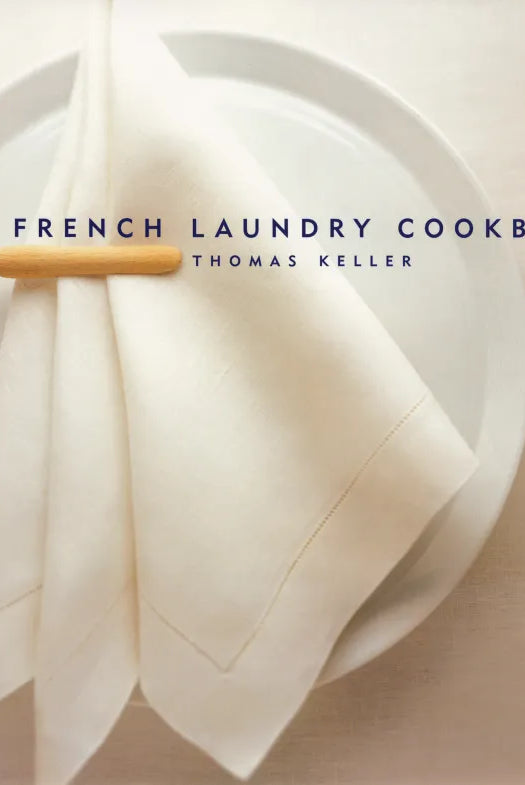 Book cover of 'The French Laundry Cookbook' by Thomas Keller with a white plate and napkin.