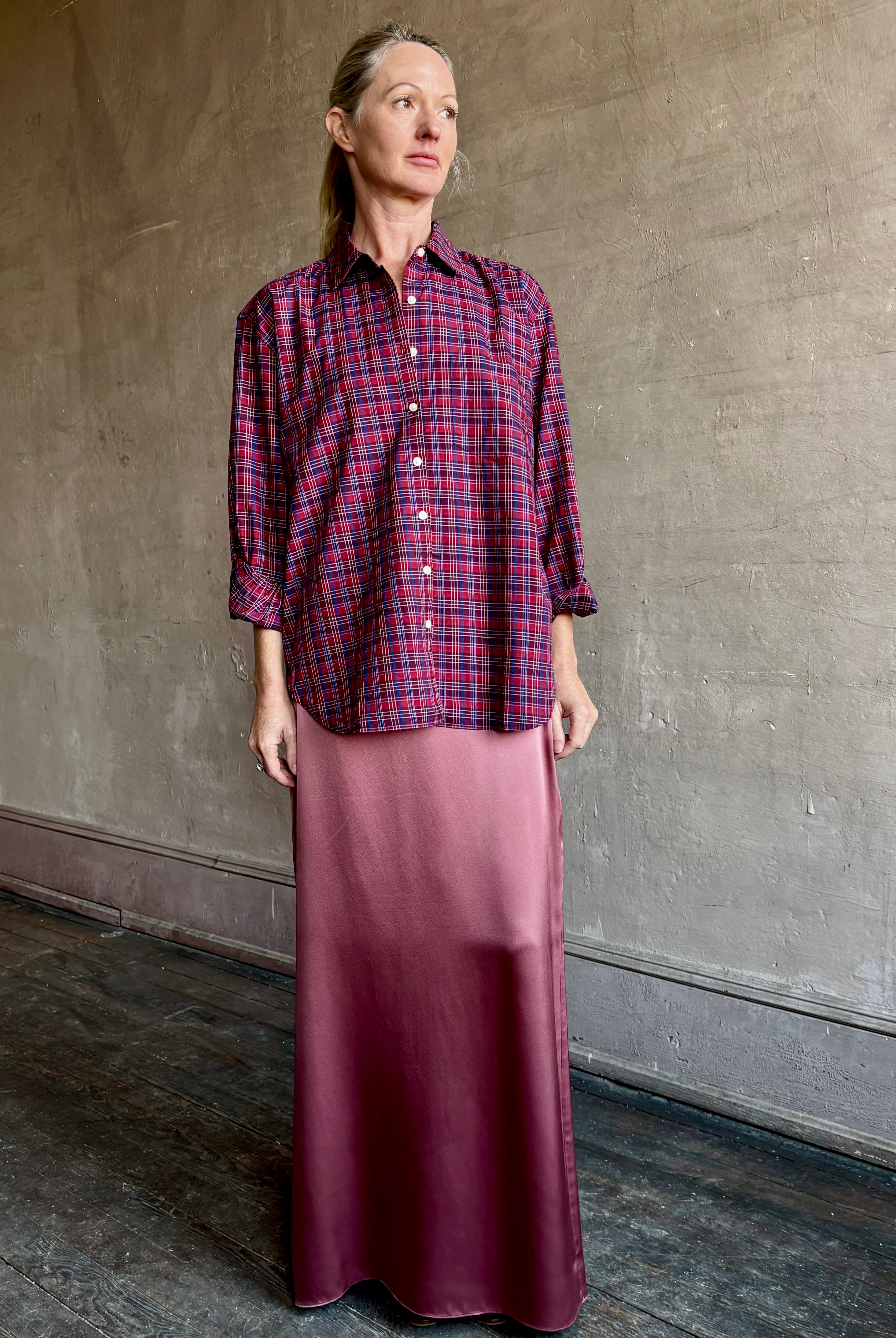 Image of mature woman wearing Trovata Blake Oversized premium cotton button down long sleeve Shirt in Mulled Wine Plaid