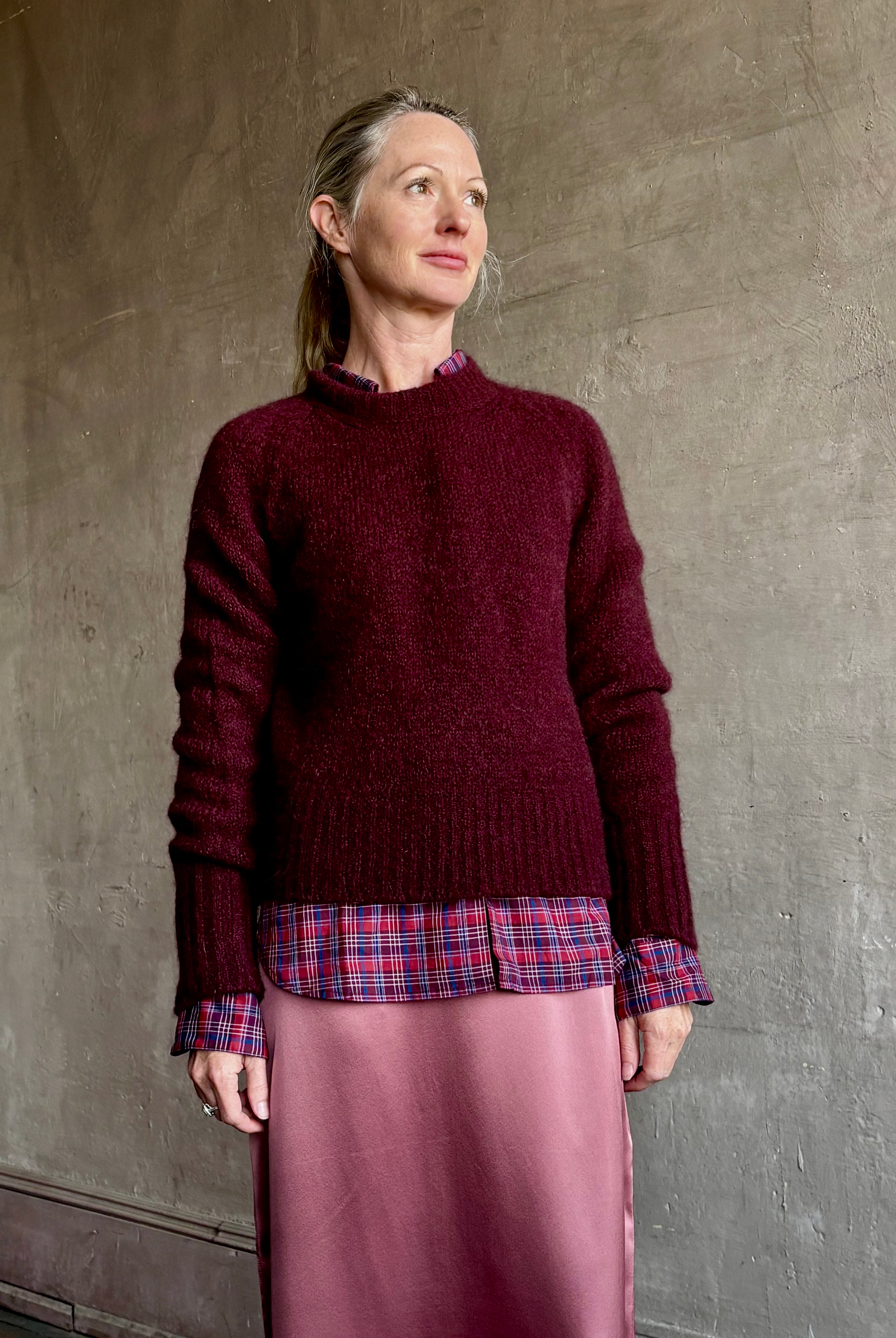 Image of mature woman wearing Trovata Blake Oversized premium cotton button down long sleeve Shirt in Mulled Wine Plaid