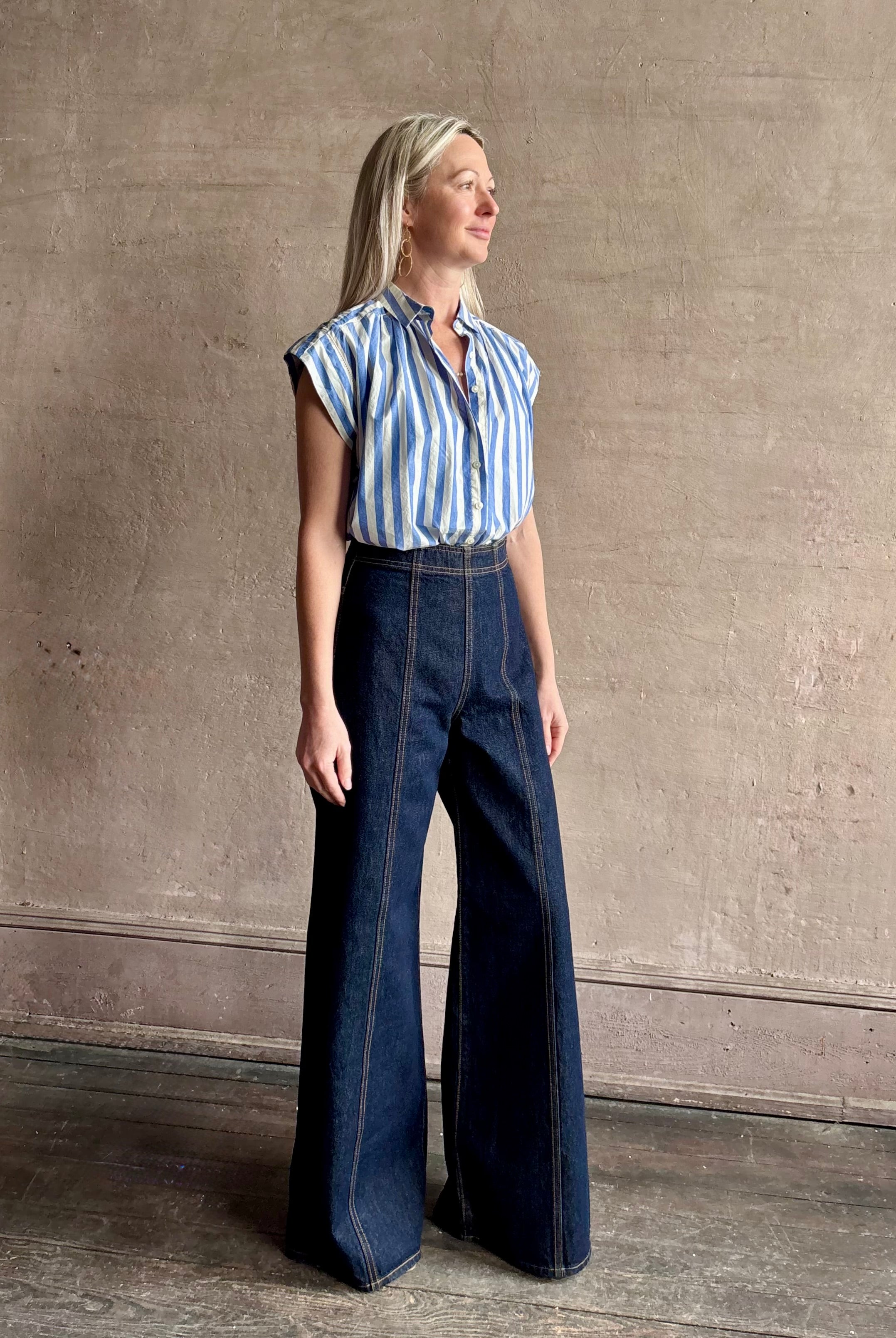 Mature woman wearing elevated everyday short sleeve cotton button-down Della Shirt from Trovata in a playful blue and white summer stripe